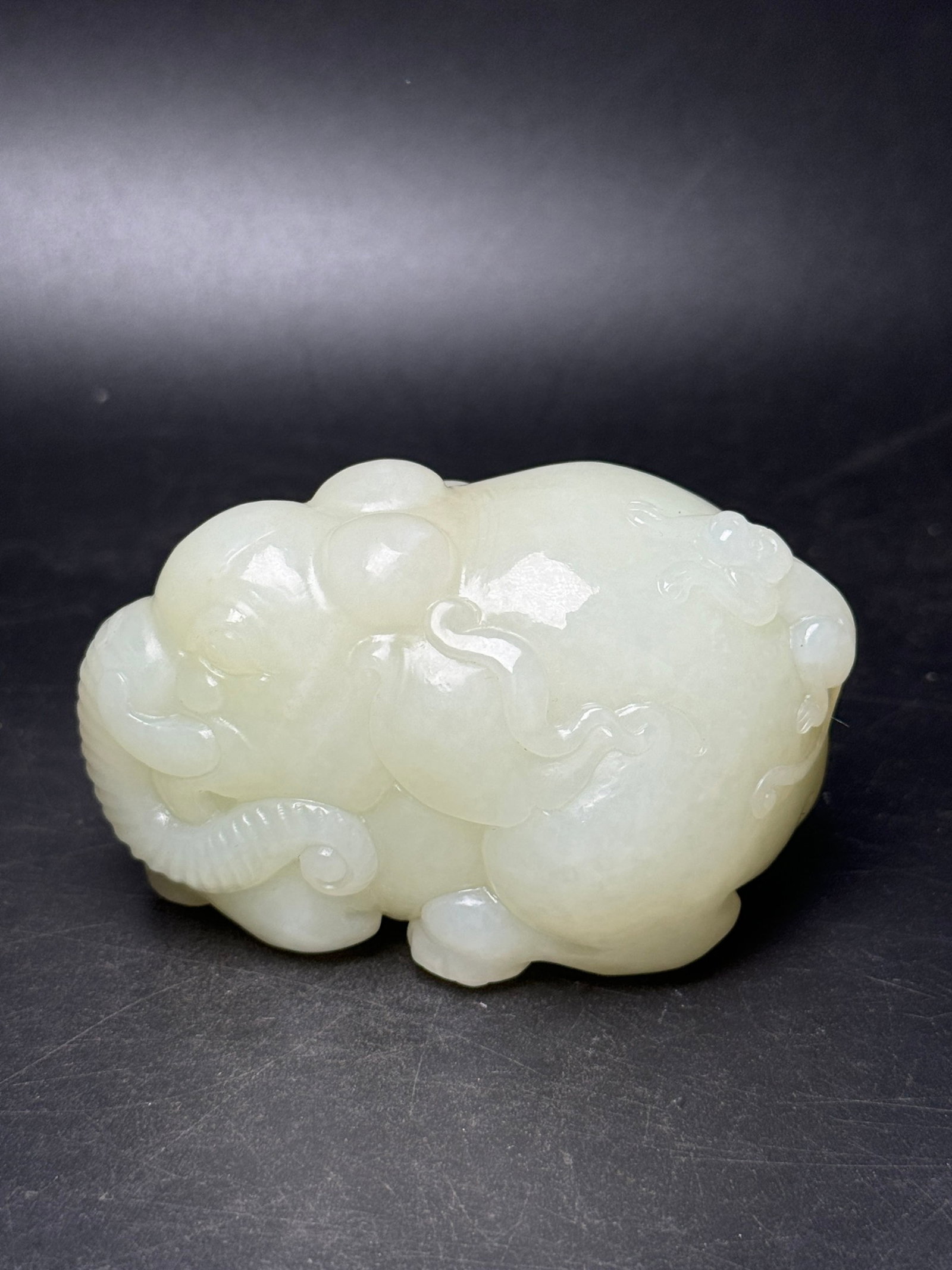 An Exquisite White Jade Elephant Hand Piece: An Exquisite White Jade Elephant Hand Piece,Qing Dynasty,China,Size:80mmx47mmx52mm,Weight:298g 白玉大象手把件,中国清代