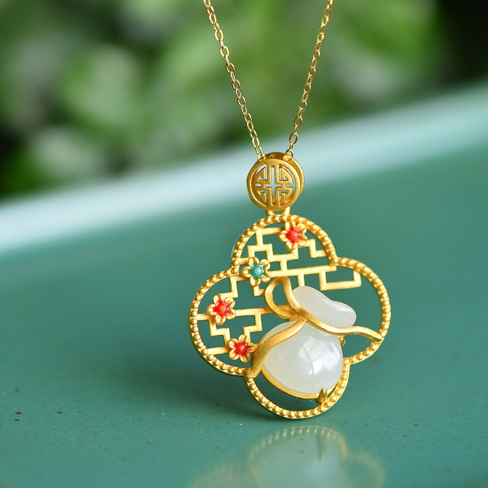An Exquisite Sterling Silver-Gold Plated Inlaid White Jade Pendant: An Exquisite Sterling Silver-Gold Plated Inlaid White Jade Pendant 纯银镀金镶白玉吊坠