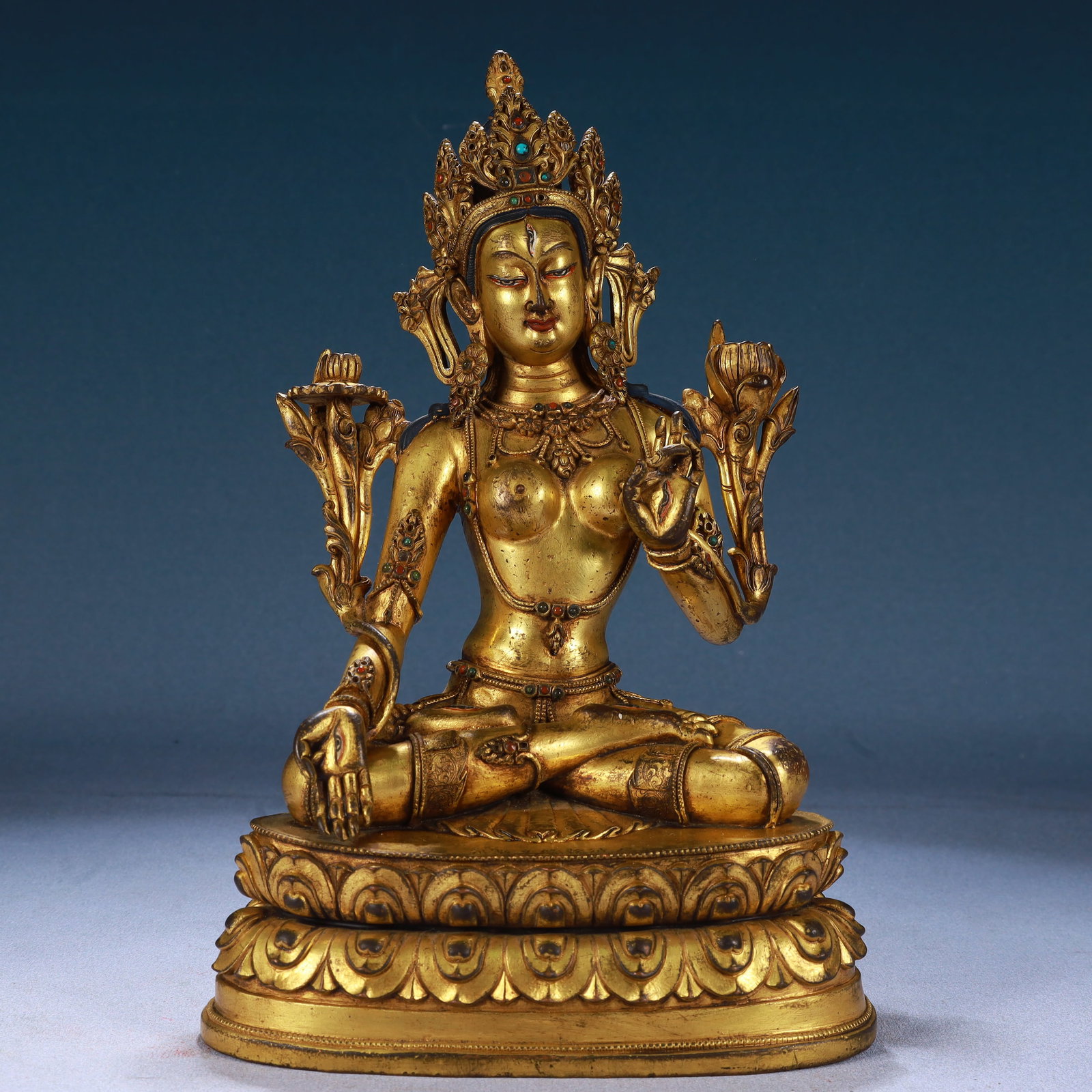 A Solemn Gilt Bronze Statue of Tara,Inlaid Gems: A Solemn Gilt Bronze Statue of Tara,Inlaid Gems,Qing Dynasty, China,Qianlong Mark,Size:6.7inx4.3inx10.2in,Weight:2750g 铜鎏金度母像,嵌宝石,中