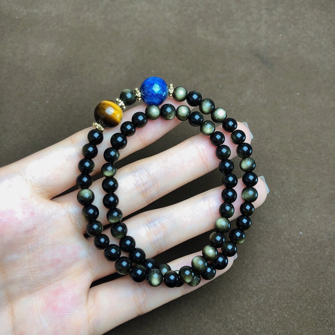 An Exquisite Gold Obsidian Bracelets: An Exquisite Gold Obsidian Bracelets,Size:6mm,11.2mm, Weight:19.7g 金耀石手串