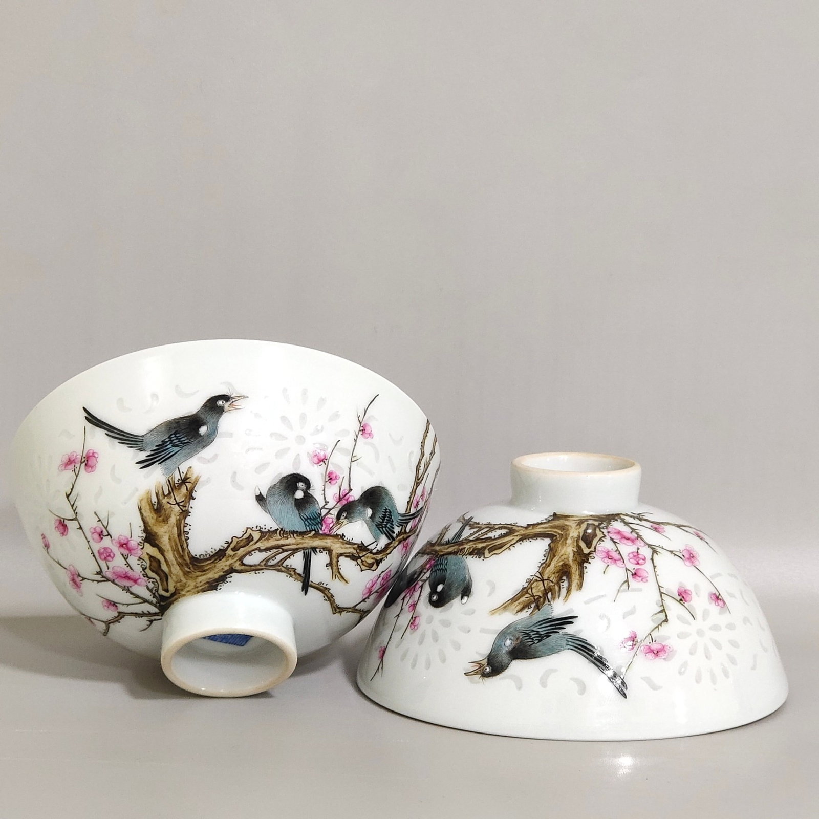 A Pair of Exquisite Famille-Rose Flower and Bird Pattern Cups: A Pair of Exquisite Famille-Rose Flower and Bird Pattern Cups,Qing Dynasty,China,Qianlong Six-character Mark,Size:2inx3.6in