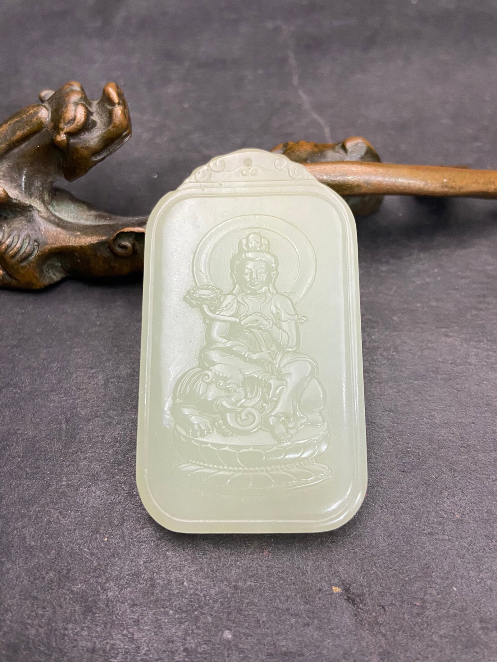 An Exquisite White Jade Statue of Samantabhadra Pattern Pendant: An Exquisite White Jade Statue of Samantabhadra Pattern Pendant,Qing Dynasty,China,Size:59mmx33.5mmx7mm,Weight:31g