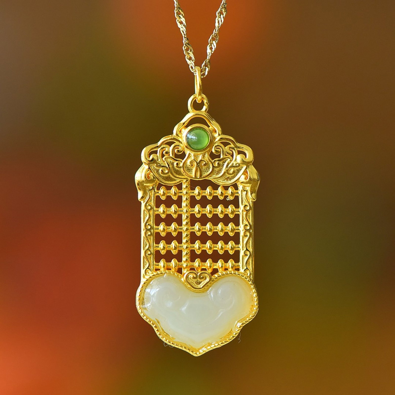 An Exquisite Sterling Silver-Gold Plated Inlaid White Jade Pendant: An Exquisite Sterling Silver-Gold Plated Inlaid White Jade Pendant,Size:11mmx17mm 纯银镀金镶白玉吊坠