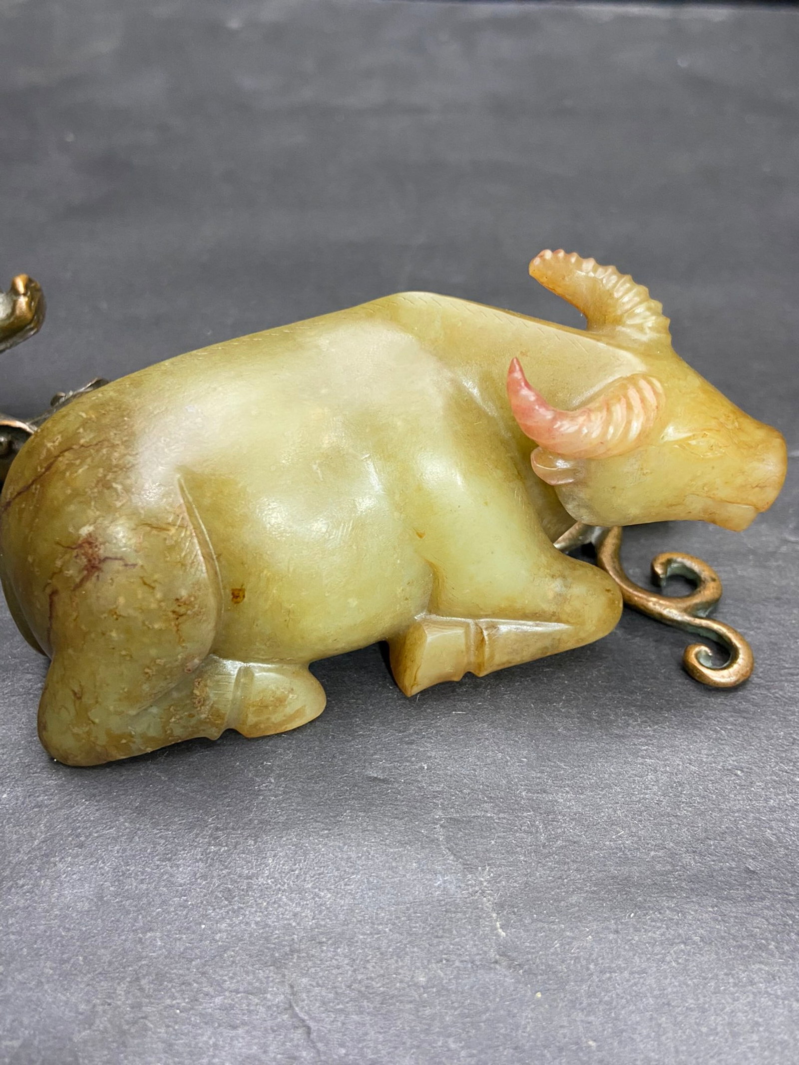 An Exquisite White Jade Buffalo Ornament: An Exquisite White Jade Buffalo Ornament,Qing Dynasty,China,Size:101.6mmx45mmx45.5mm,Weight:290g 白玉牛摆件,中国清代