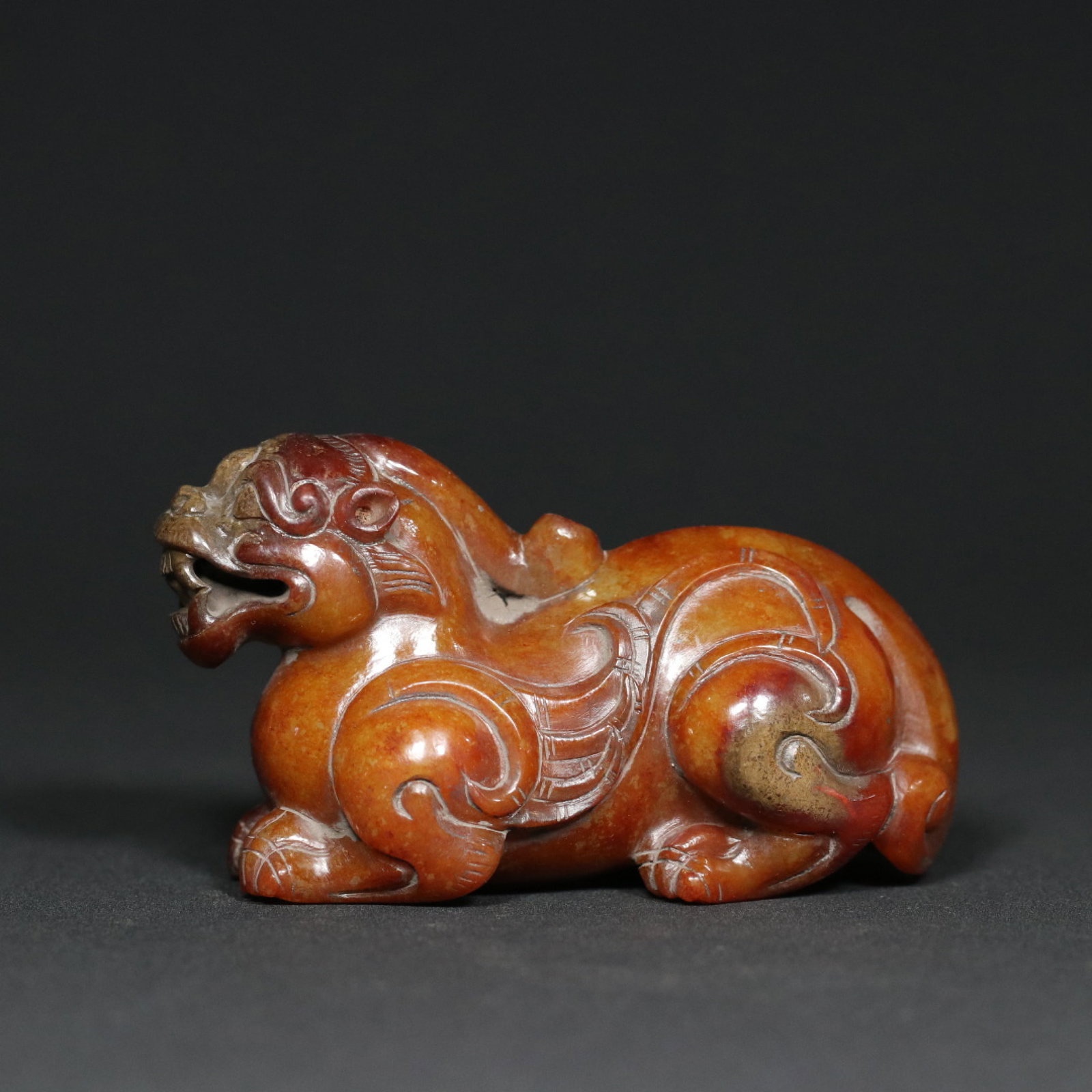 An Exquisite White Jade Auspicious Beast Ornament: An Exquisite White Jade Auspicious Beast Ornament,Qing Dynasty,China,Size:3.3inx1.5inx1.9in,Weight:179.2g 白玉瑞兽摆件,中国清代