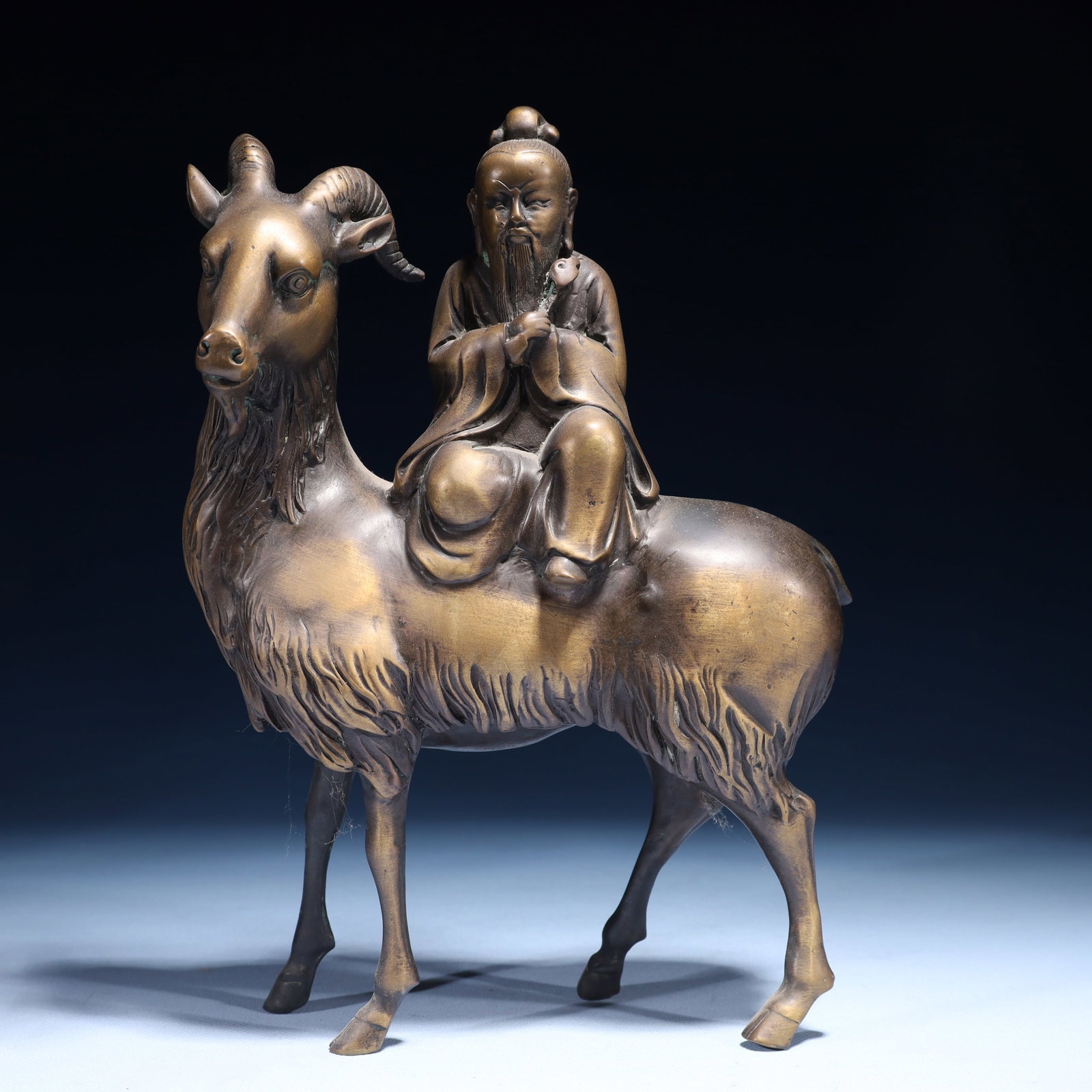 An Exquisite Bronze Figure Riding Sheep Ornament: An Exquisite Bronze Figure Riding Sheep Ornament,Qing Dynasty,China,Size:7.1inx2.8inx10.2in,Weight:2200g 铜人物骑羊摆件,中国清代