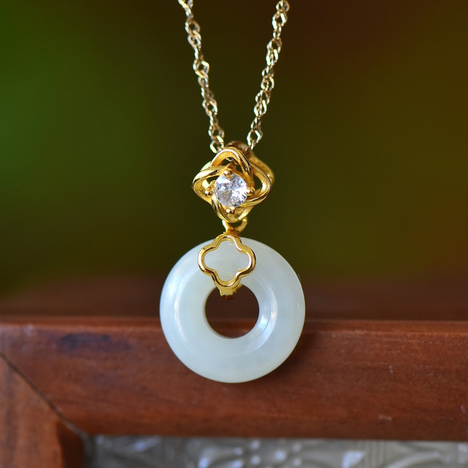 An Exquisite Sterling Silver-Gold Plated Inlaid White Jade Pendant: An Exquisite Sterling Silver-Gold Plated Inlaid White Jade Pendant,Size:15mmx15mm 纯银镀金镶白玉吊坠