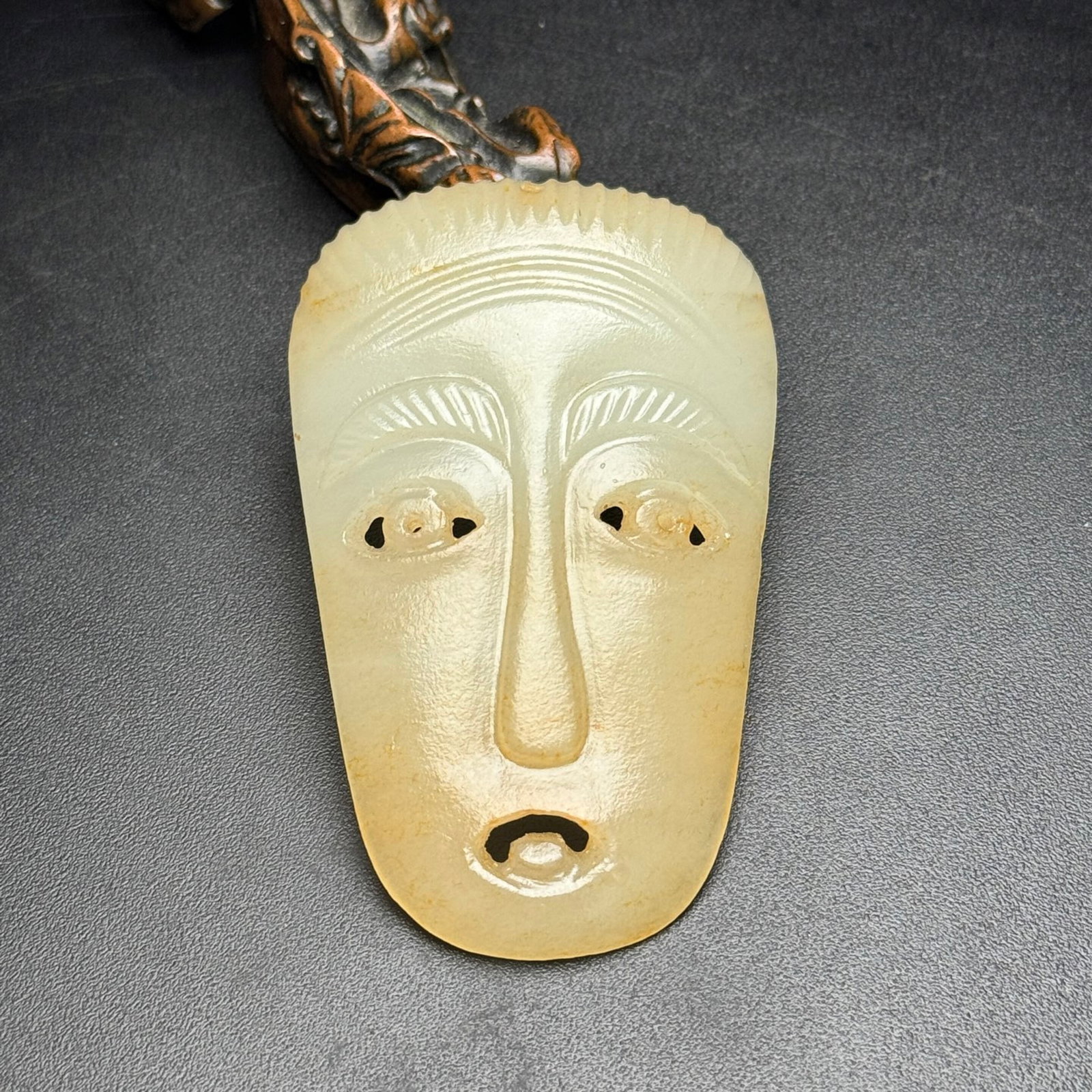 An Exquisite White Jade Figure-Face Pattern Pendant: An Exquisite White Jade Figure-Face Pattern Pendant,Qing Dynasty,China,Size:48mmx78mmx12mm,Weight:38g 白玉人面纹挂件,中国清代