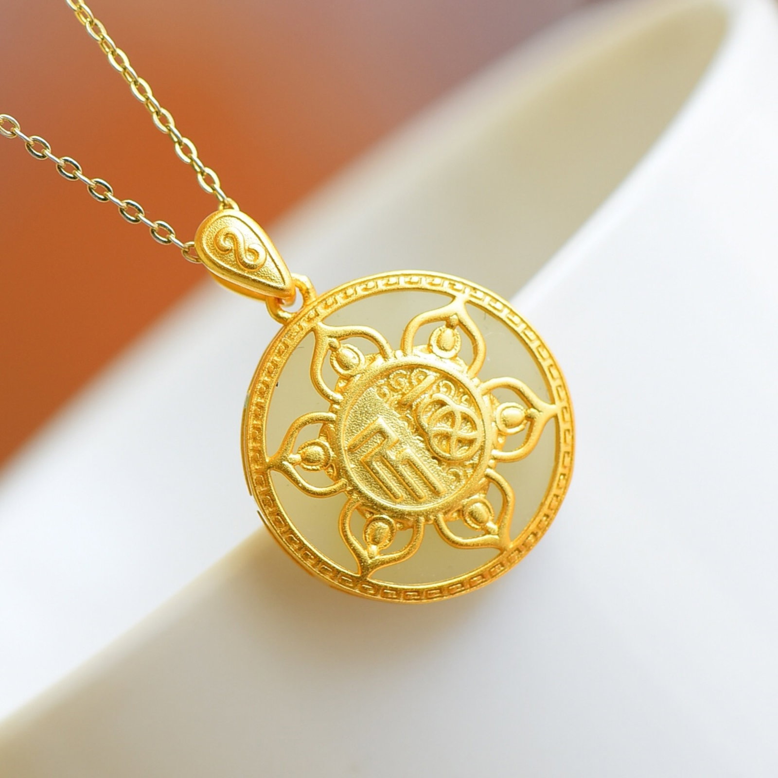 An Exquisite Sterling Silver-Gold Plated Inlaid White Jade Pendant: Sterling Silver-Gold Plated Inlaid White Jade Pendant , Size :18mmx18mm 纯银镀金镶白玉吊坠,尺寸:18mmx18mm