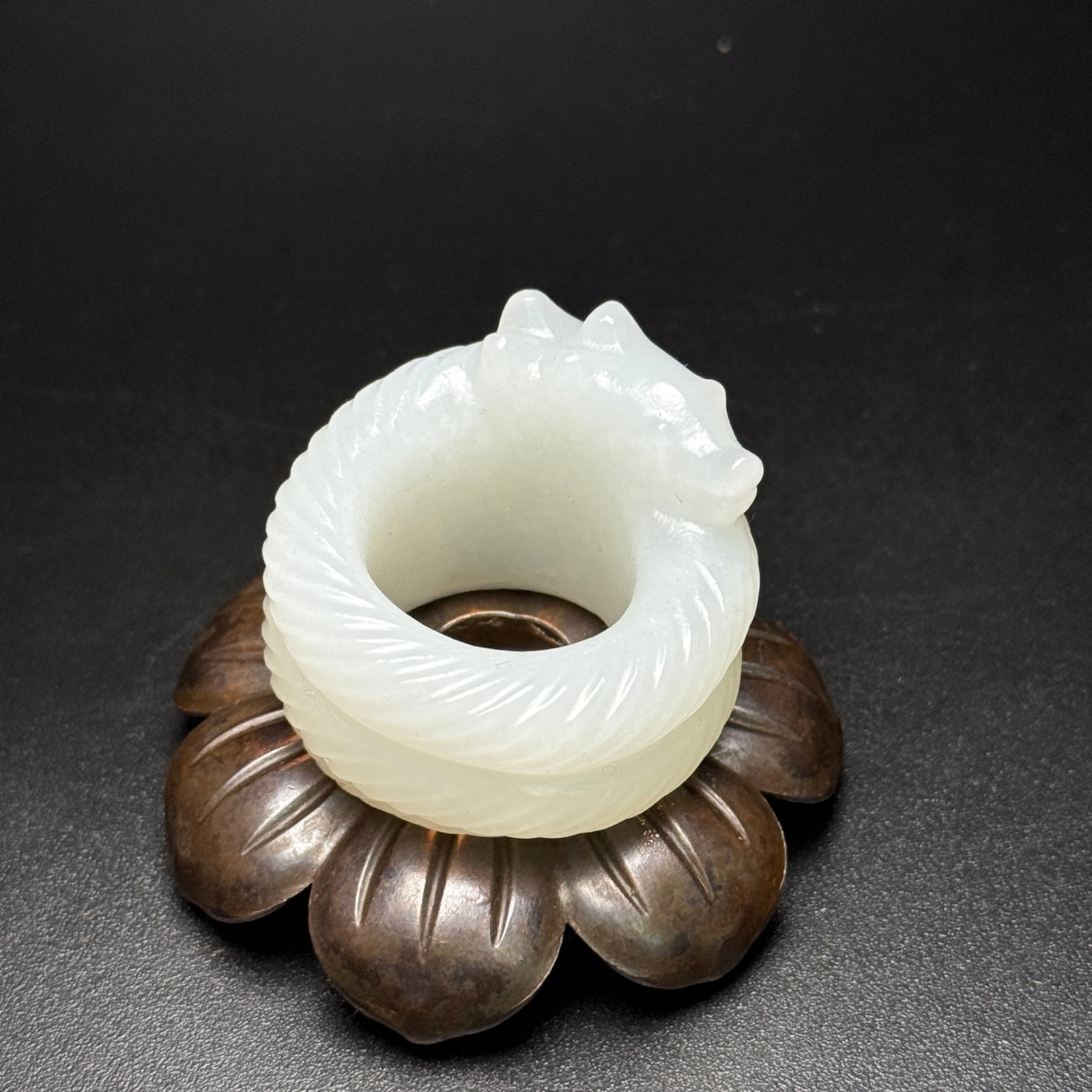 An Exquisite White Jade Dragon Pattern Fingerstall: An Exquisite White Jade Dragon Pattern Fingerstall,Qing Dynasty,China,Size:40mmx42mmx30mm,Weight:53g 白玉龙纹扳指,中国清代