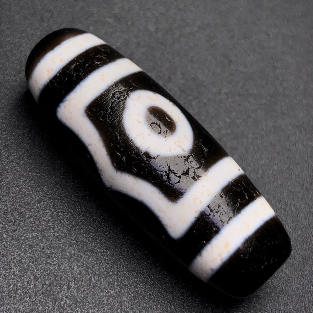 An Exquisite Three Eyes Dzi Bead Pendant: An Exquisite Three Eyes Dzi Bead Pendant,Size:38mmx14mmx12mm,Weight:10.6g 三眼天珠挂件