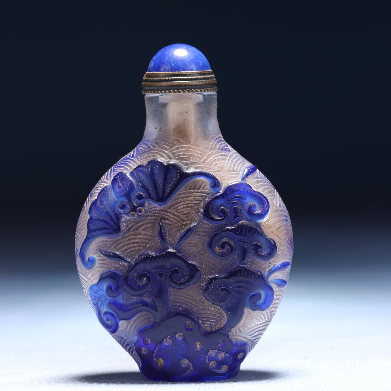 An Exquisite Glass Auspicious Cloud and Bats Pattern Snuff Bottle: An Exquisite Glass Auspicious Cloud and Bats Pattern Snuff Bottle,Qing Dynasty,China,Daoguang Four-character Mark,Size:1.8inx1inx2.8in,Weight:63g
