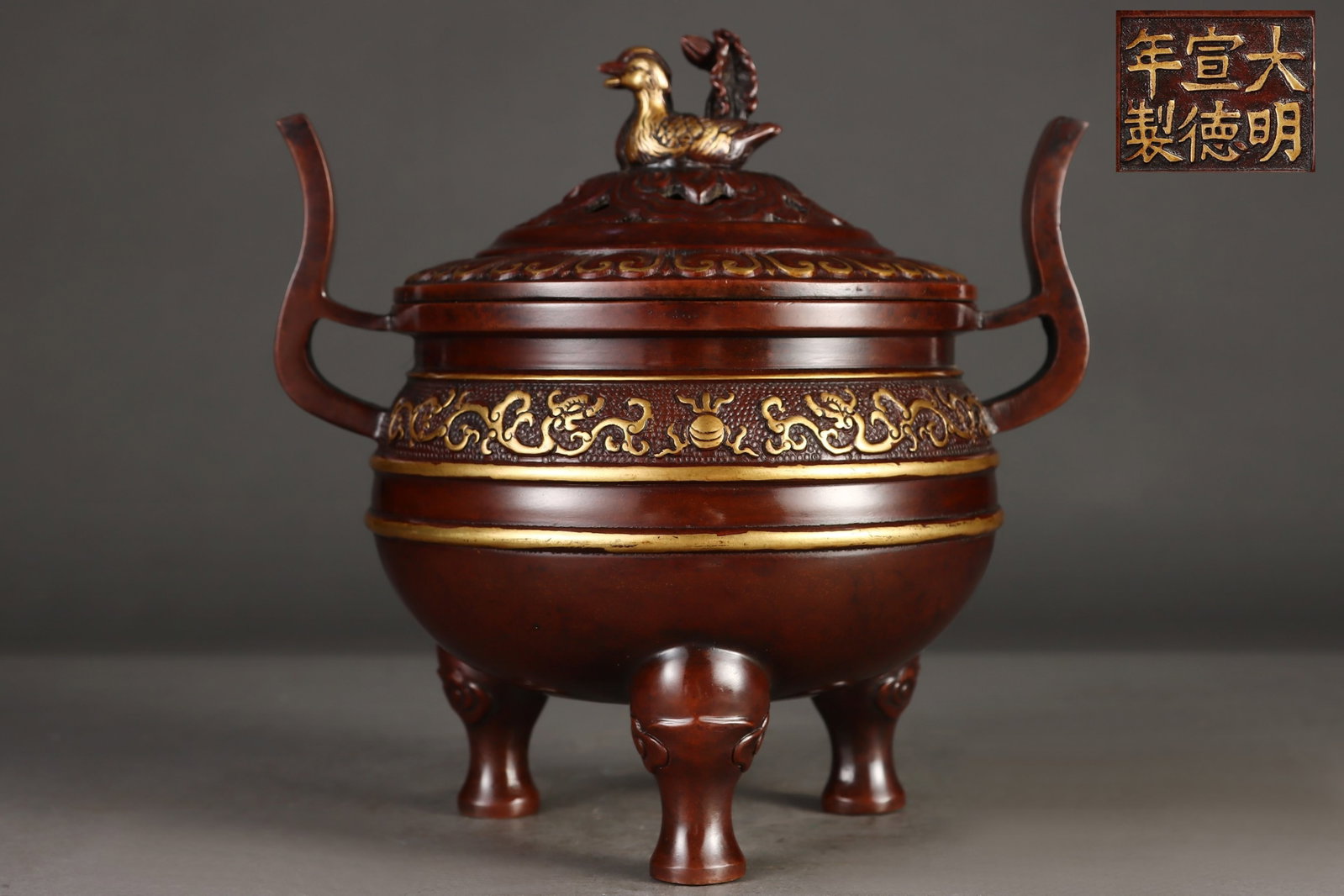 An Exquisite Gilt Bronze Dragon Pattern Double-Ears Tripod Censer: An Exquisite Gilt Bronze Dragon Pattern Double-Ears Tripod Censer,Ming Dynasty,China,Xuande Six-character Mark,Size:7.7inx5.6inx6.3inx7.7in,Weight:3500g 铜鎏金龙纹双