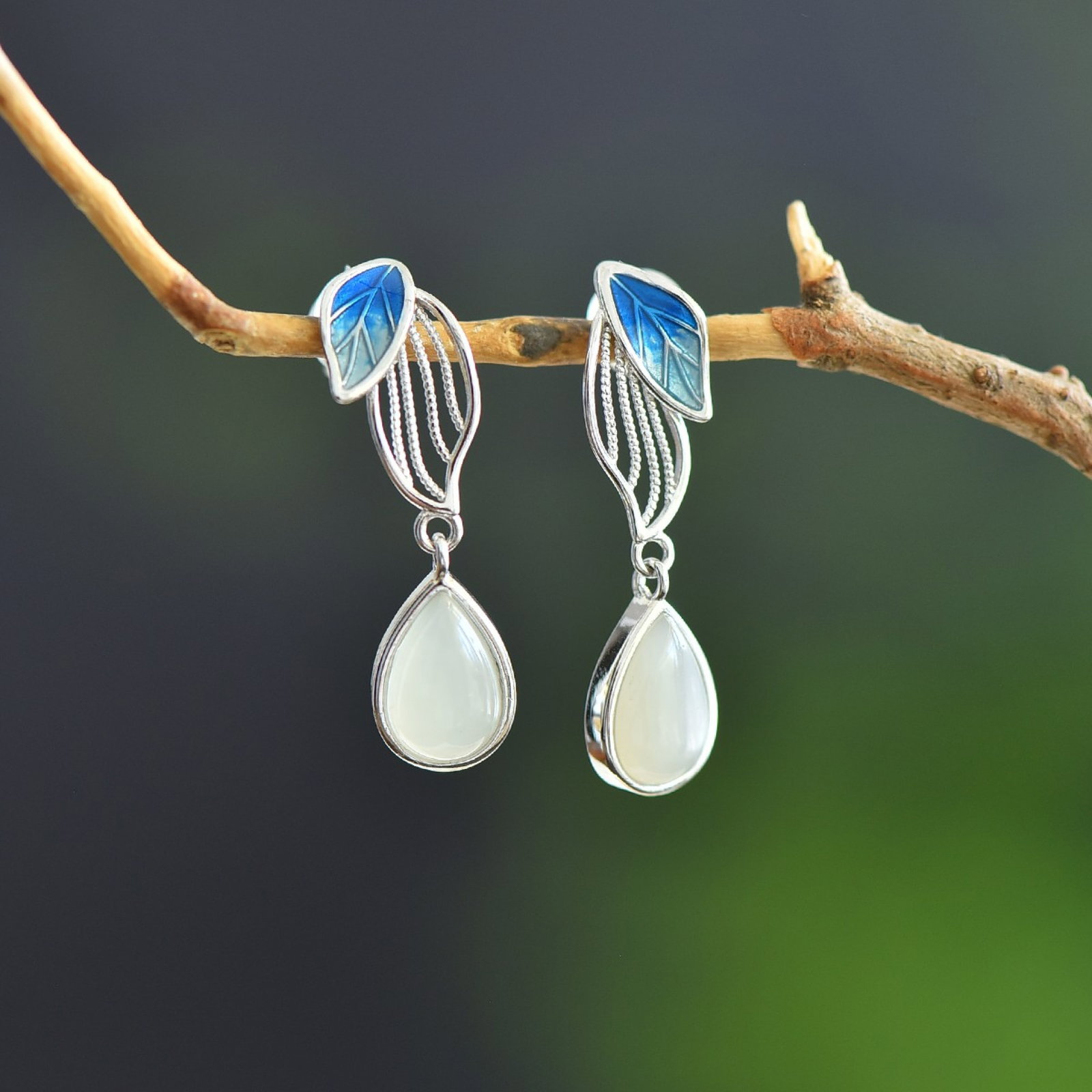 A Pair of Exquisite Sterling Silver Inlaid White Jade Earrings: A Pair of Exquisite Sterling Silver Inlaid White Jade Earrings,Size:6mmx9mm 一对纯银镶白玉耳环