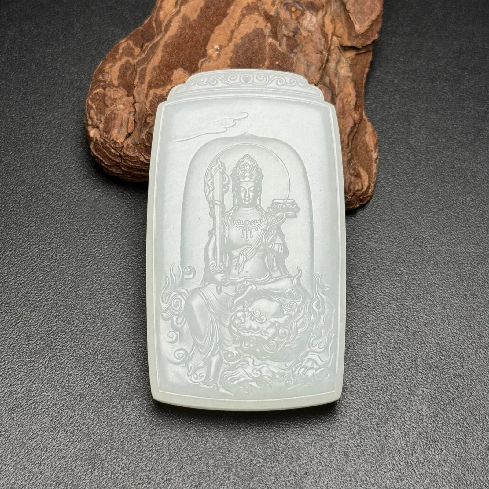 An Exquisite White Jade Statue of Manjusri Pattern Pendant: An Exquisite White Jade Statue of Manjusri Pattern Pendant,Qing Dynasty,China,Size:64mmx36mmx9mm,Weight:51g 白玉文殊菩萨像纹挂件,中