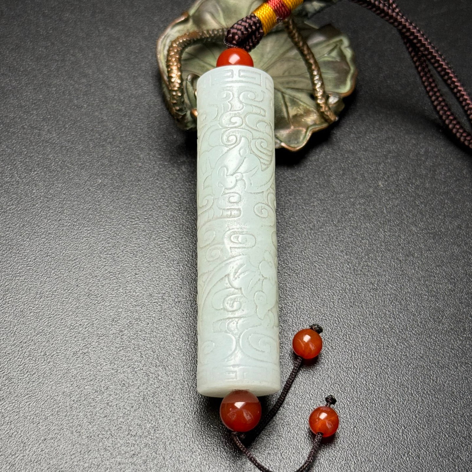 An Exquisite White Jade Auspicious Cloud and Bats Pattern Pendant: An Exquisite White Jade Auspicious Cloud and Bats Pattern Pendant,Qing Dynasty,China,Size:16mmx67mm,Weight:43g