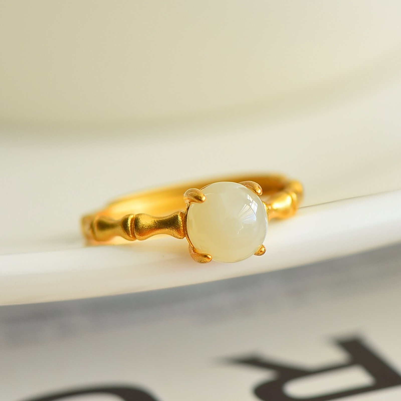 An Exquisite Sterling Silver-Gold Plated Inlaid White Jade Ring: Sterling Silver-Gold Plated Inlaid White Jade Ring , Size :7mmx7mm 纯银镀金镶白玉戒指,尺寸:7mmx7mm