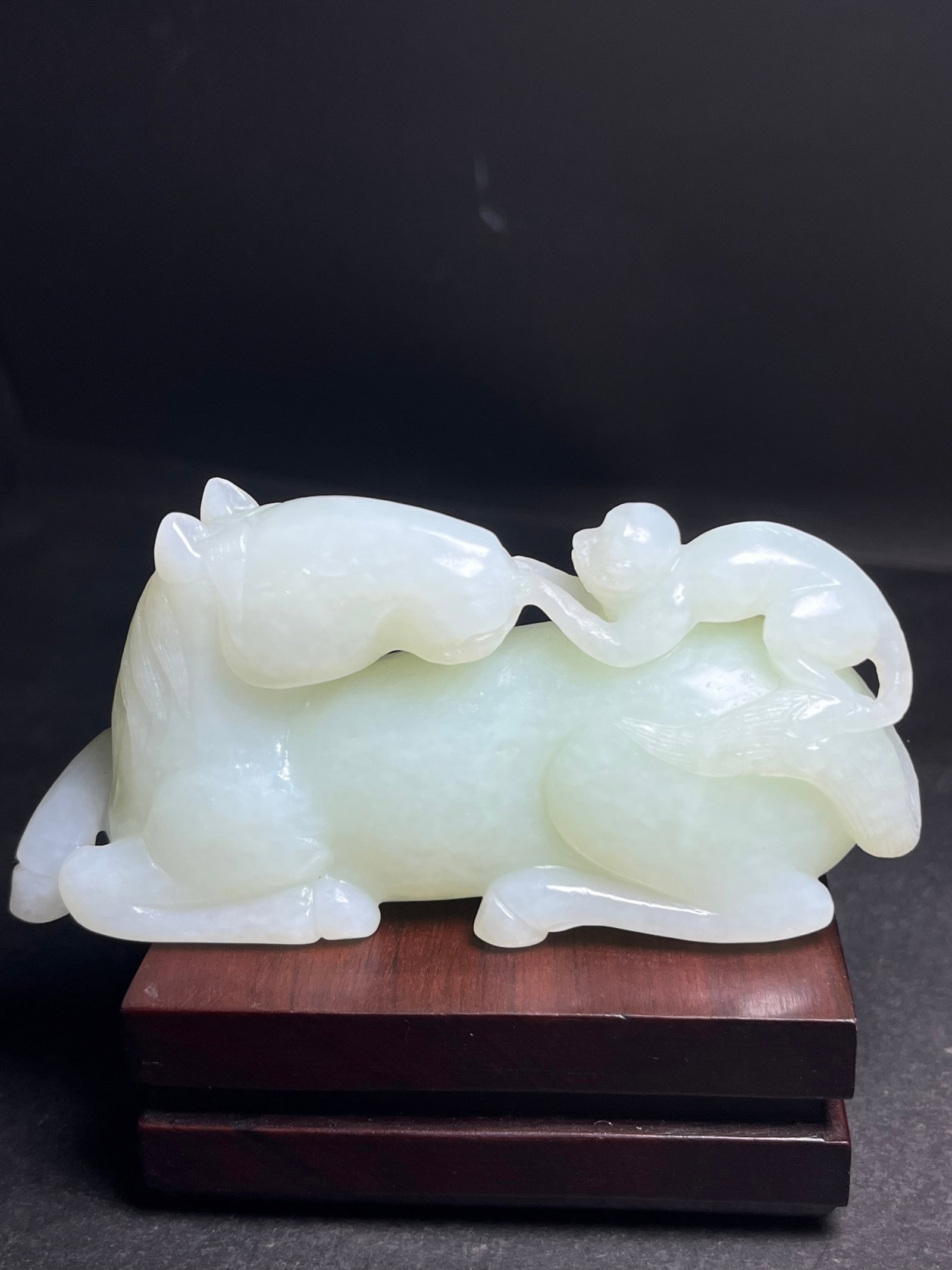 An Exquisite White Jade Monkey Pattern Horse Hand Piece: An Exquisite White Jade Monkey Pattern Horse Hand Piece,Qing Dynasty,China,Size:106mmx29mmx52mm,Weight:198g 白玉猴纹马手把件,中国清