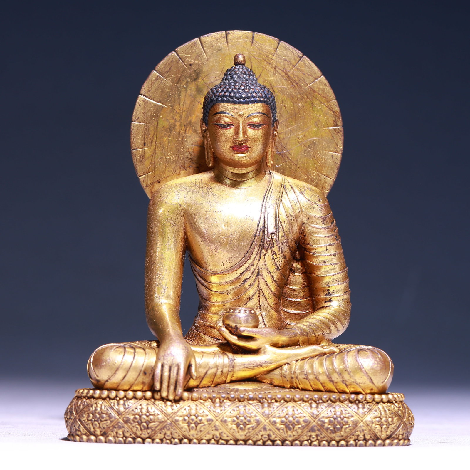 A Solemn Gilt Bronze Statue of Sakyamuni: A Solemn Gilt Bronze Statue of Sakyamuni,Qing Dynasty,China,Size:5.1inx3inx6.3in,Weight:1100g 铜鎏金释迦摩尼像,中国清代