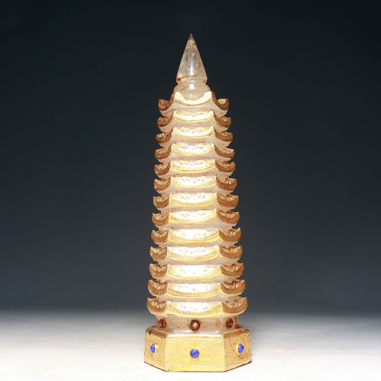 A Rare Crystal Cover with Gold Pagoda,Inlaid Gems: A Rare Crystal Cover with Gold Pagoda,Inlaid Gems,Qing Dynasty, China,Size:4.3inx13in,Weight:3250g 水晶包金佛塔,嵌宝石,中国清