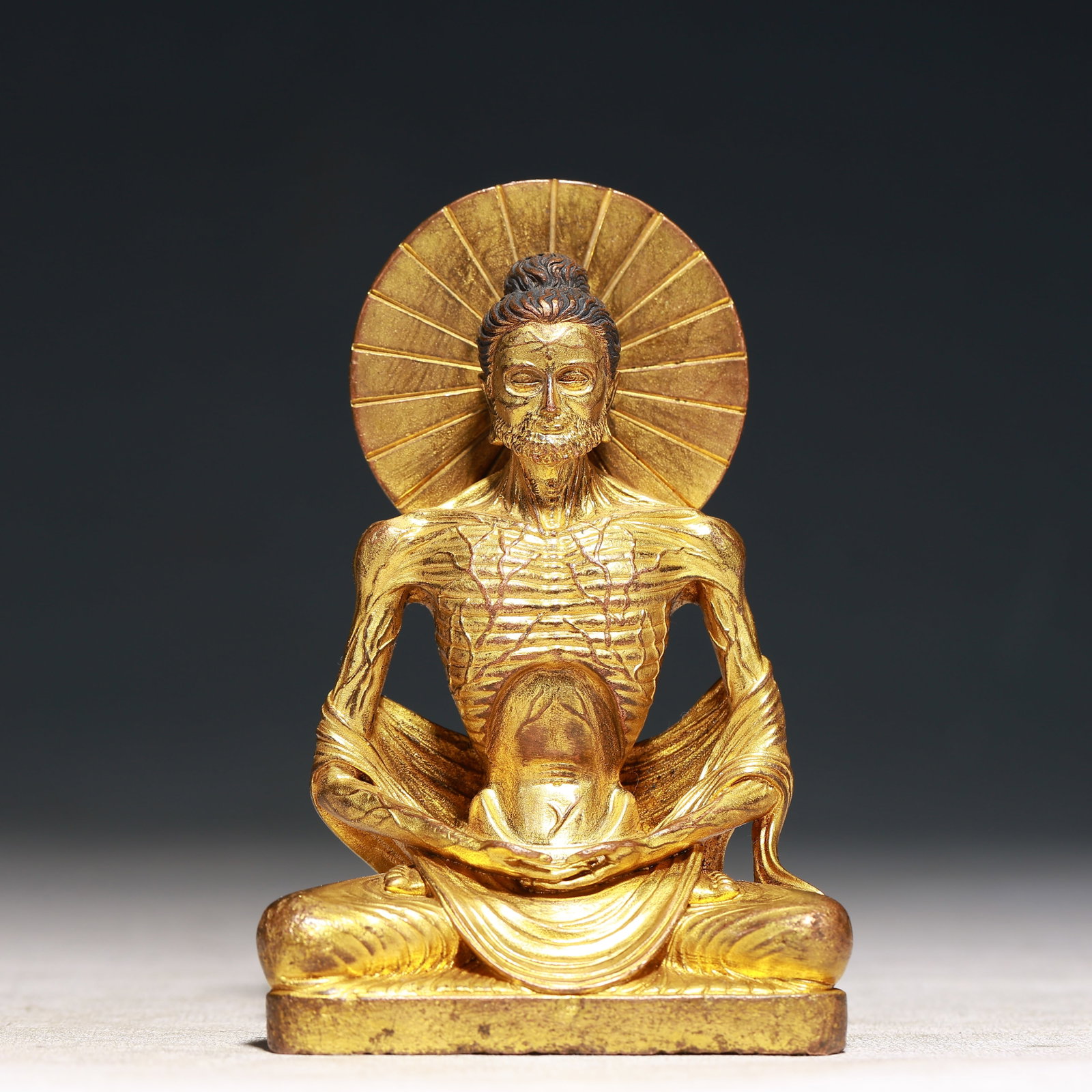 A Solemn Gilt Bronze Statue of Arhat: A Solemn Gilt Bronze Statue of Arhat,Qing Dynasty,China,Size:3inx1.6inx4.5in,Weight:300g 铜鎏金罗汉像,中国清代