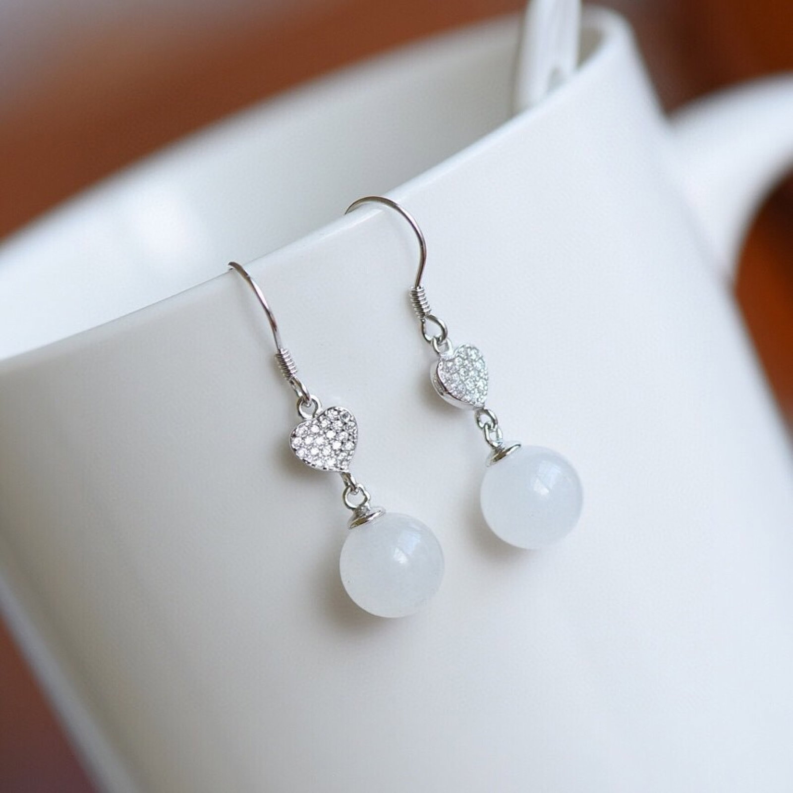 A Pair of Exquisite Sterling Silver Inlaid White Jade Earrings , Inlaid Diamonds: A Pair of Sterling Silver Inlaid White Jade Earrings , Inlaid Diamond , Size :10mmx10mms 一对纯银镶白玉耳环,嵌钻石,尺ë