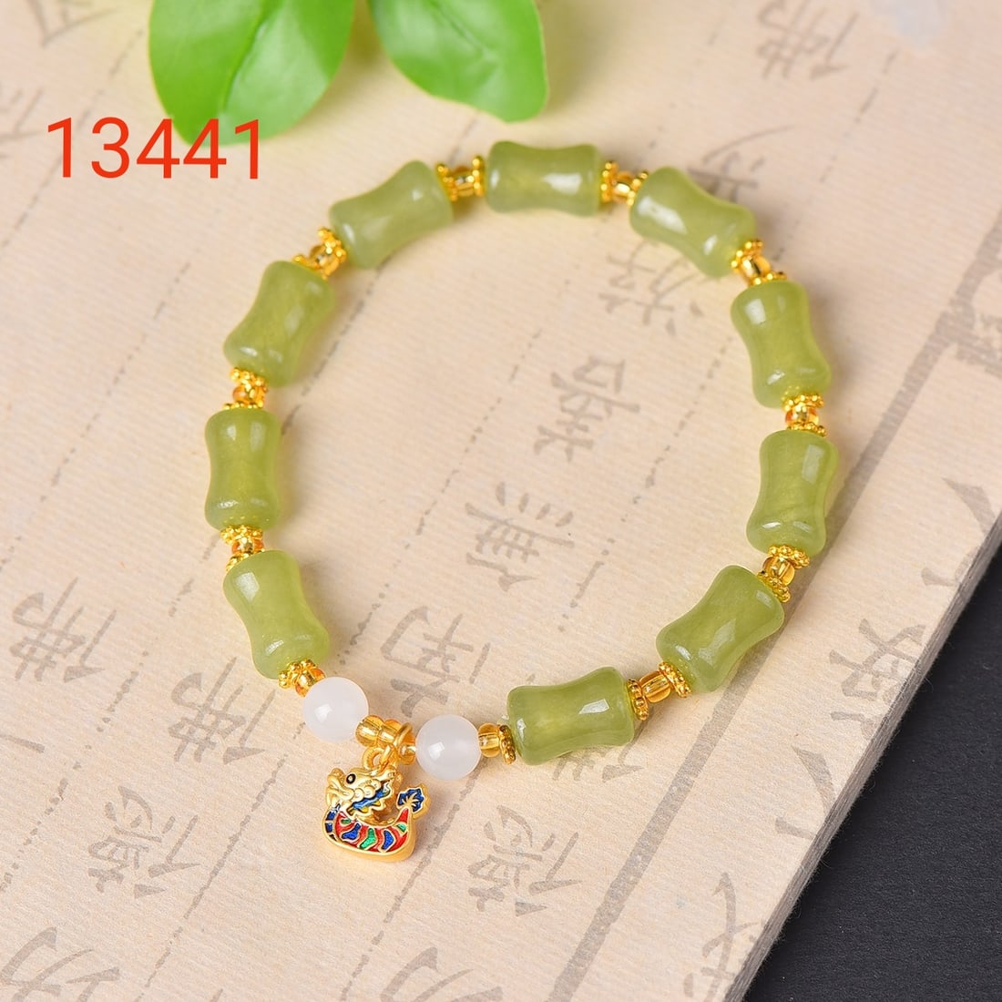 An Exquisite Greenish Jade Bracelets: An Exquisite Greenish Jade Bracelets,Size:8mmx12mm 寓意:寓意着佩戴者拥有幸福和好运