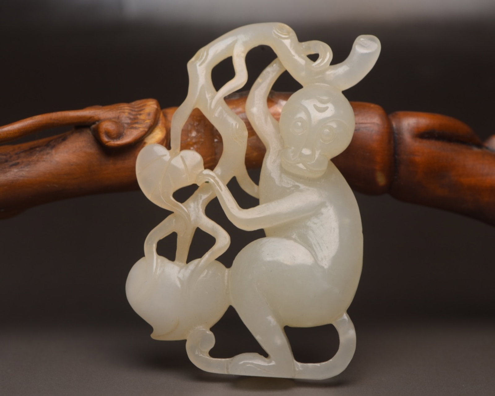 An Exquisite White Jade Monkey Pendant: An Exquisite White Jade Monkey Pendant,Qing Dynasty,China,Size:2.6inx1.7inx0.5in,Weight:33g 白玉猴子佩,中国清代