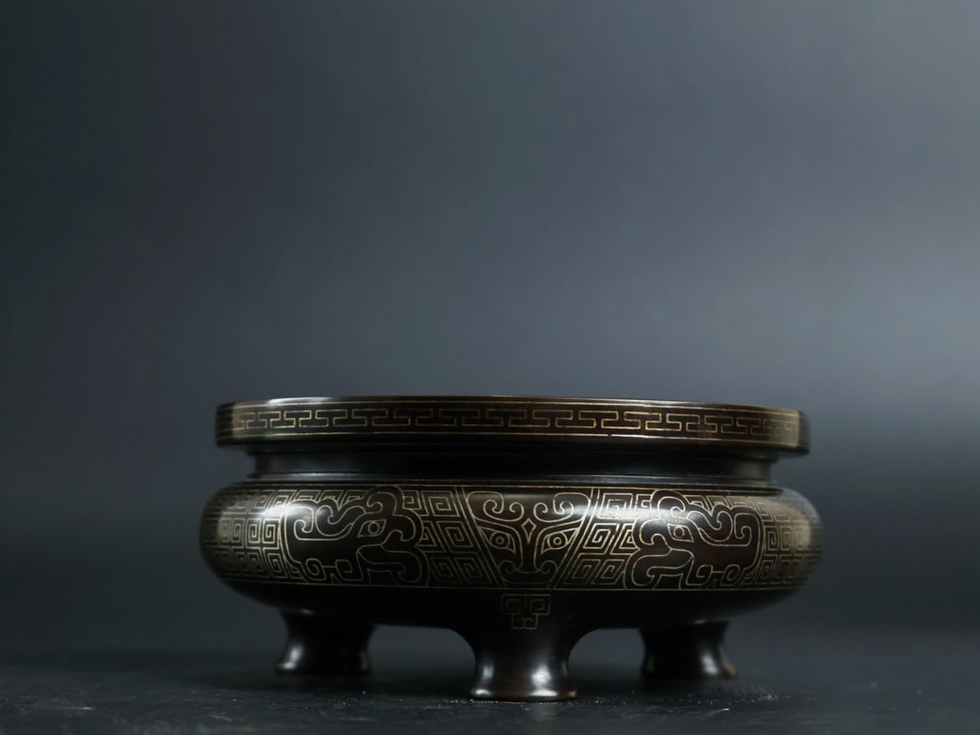 An Exquisite Bronze Inlaid Silver Beast-Face Pattern Tripod Censer: An Exquisite Bronze Inlaid Silver Beast-Face Pattern Tripod Censer,Qing Dynasty, China, With Mark,Size:1.8inx4.1in,Weight:740g 铜嵌银兽面纹三足香&