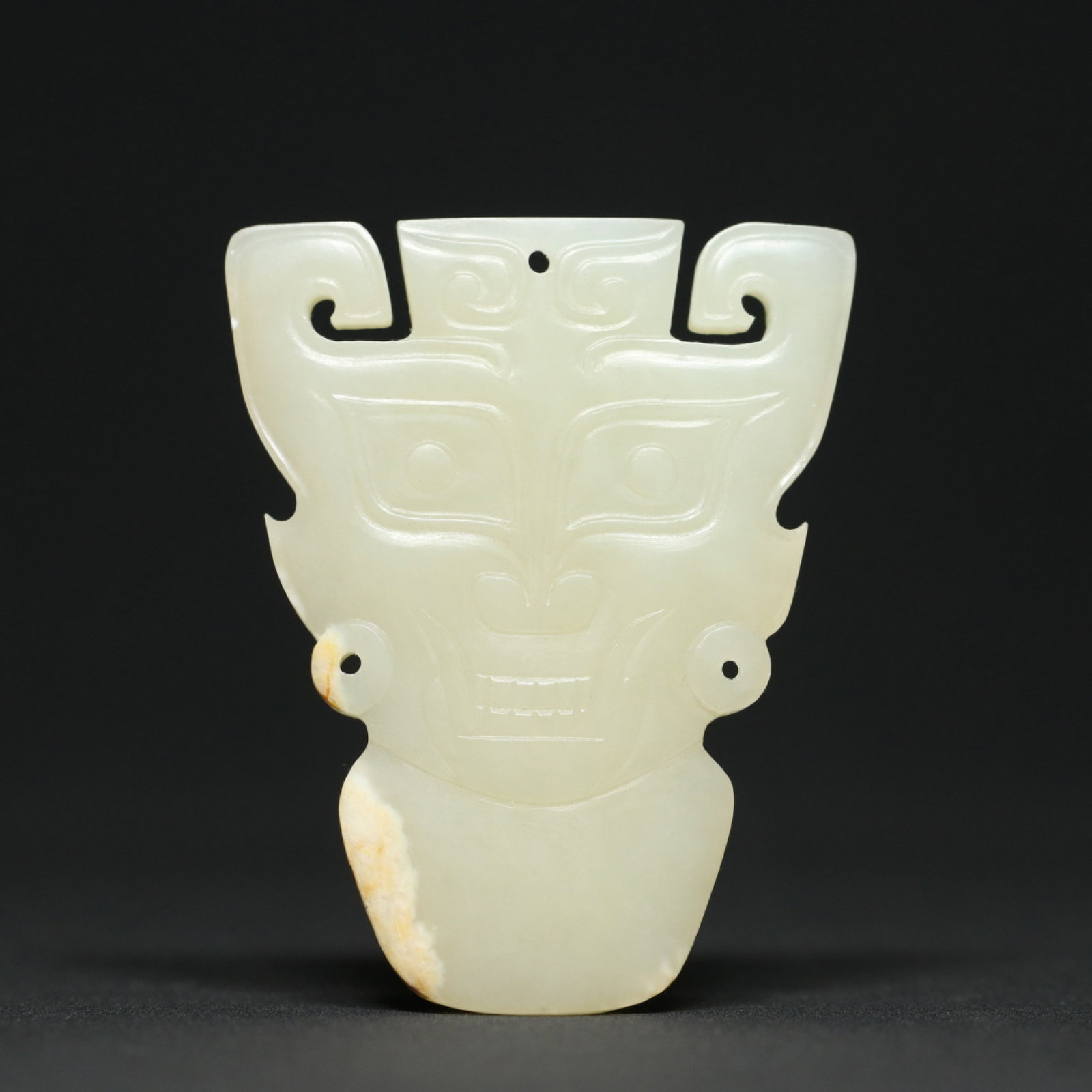 An Exquisite White Jade Figure-Face Pattern Pendant: An Exquisite White Jade Figure-Face Pattern Pendant,Qing Dynasty,China,Size:2.4inx1.9inx0.2in,Weight:29.3g 白玉人面纹佩,中国清代