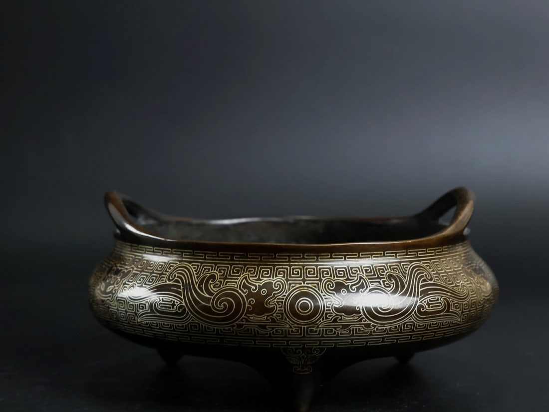 An Exquisite Bronze Inlaid Silver Beast-Face Pattern Double-Ears and Tripod Censer: An Exquisite Bronze Inlaid Silver Beast-Face Pattern Double-Ears and Tripod Censer,Qing Dynasty, China, With Mark,Size:2.8inx5.1in,Weight:1365g