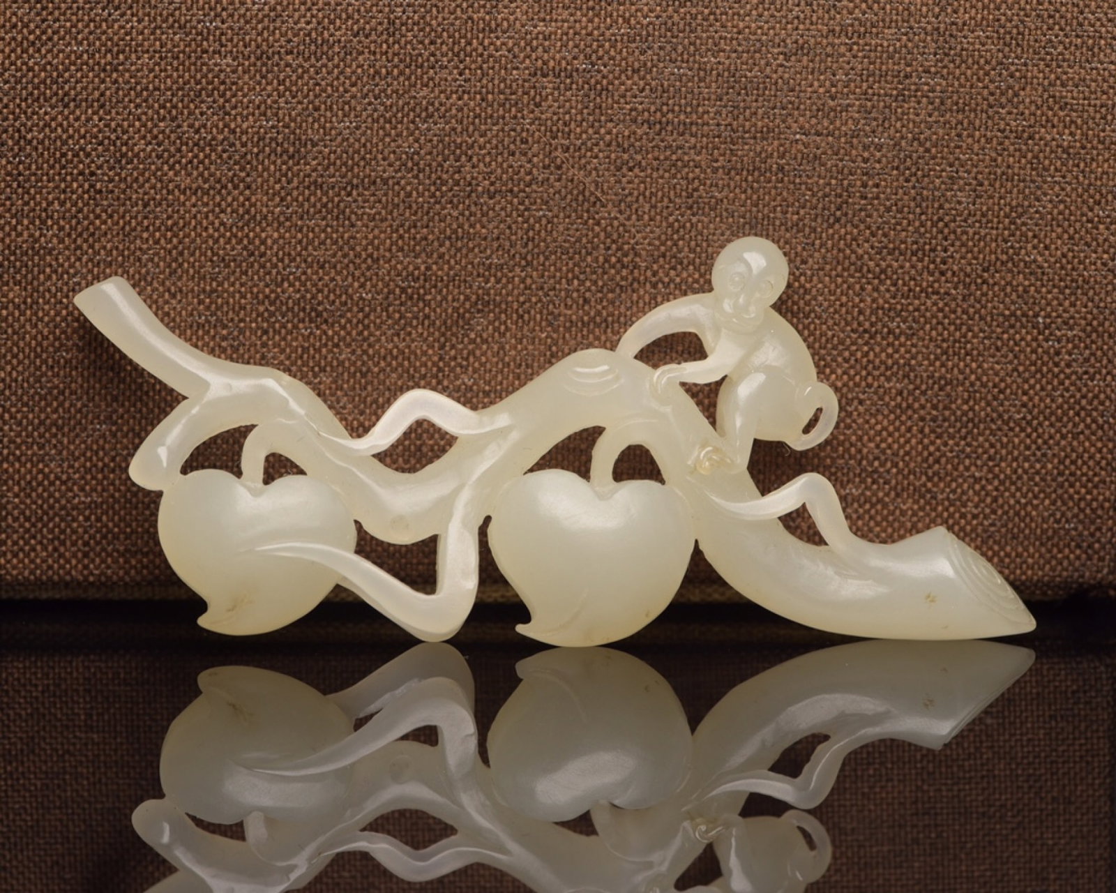 An Exquisite White Jade Monkey Ornament: An Exquisite White Jade Monkey Ornament,Qing Dynasty,China,Size:3.8inx1.7inx0.4in,Weight:31g 白玉猴子摆件,中国清代