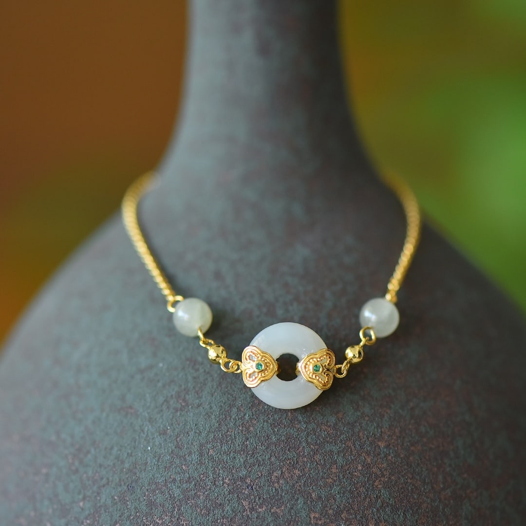 An Exquisite Sterling Silver-Gold Plated Inlaid White Jade Bracelet: An Exquisite Sterling Silver-Gold Plated Inlaid White Jade Bracelet,Size:0.5inx0.5in 纯银镀金镶白玉手链
