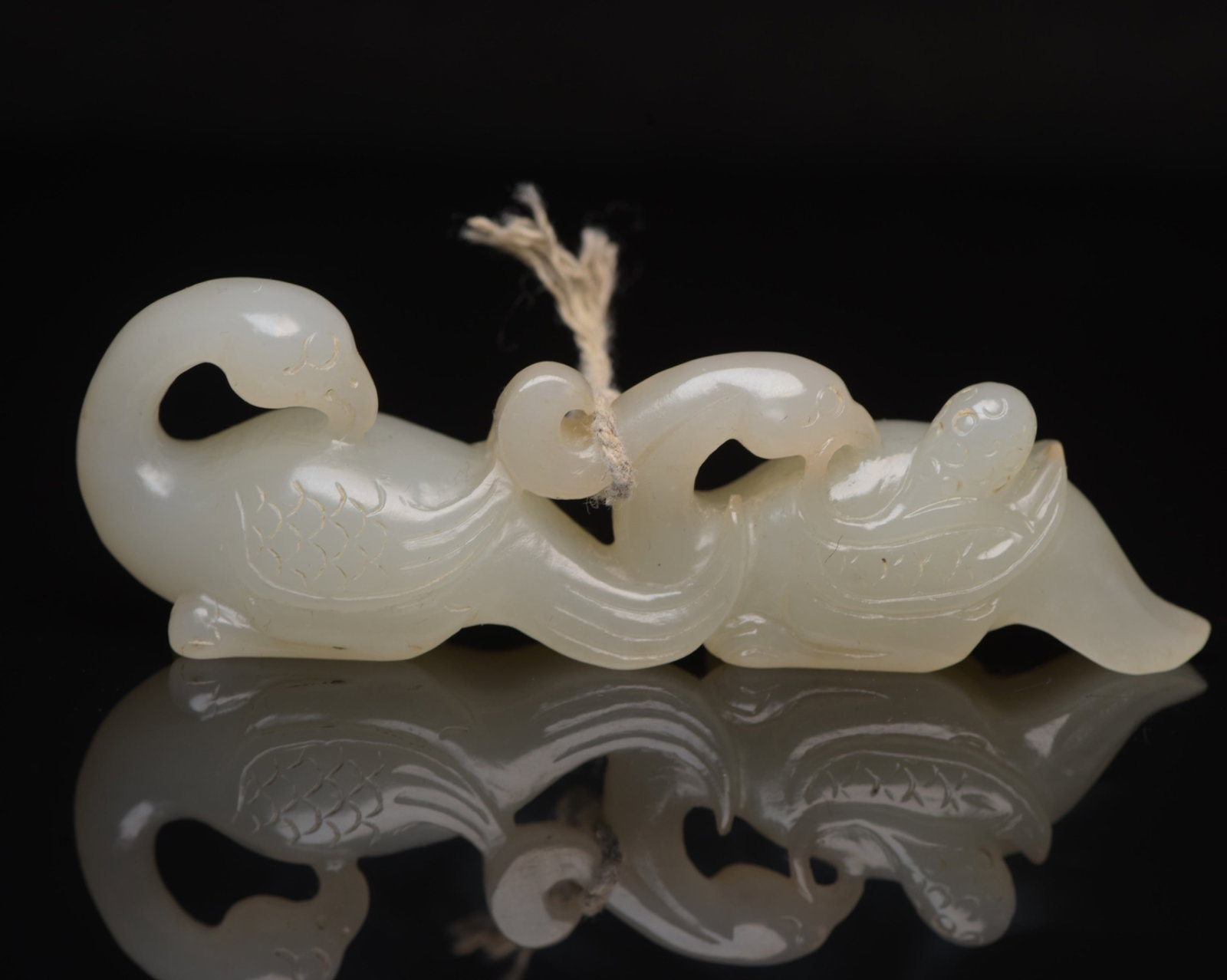 An Exquisite White Jade Goose Pendant: An Exquisite White Jade Goose Pendant,Qing Dynasty,China,Size:3.5inx1.1inx0.7in,Weight:53g 白玉鹅挂件,中国清代