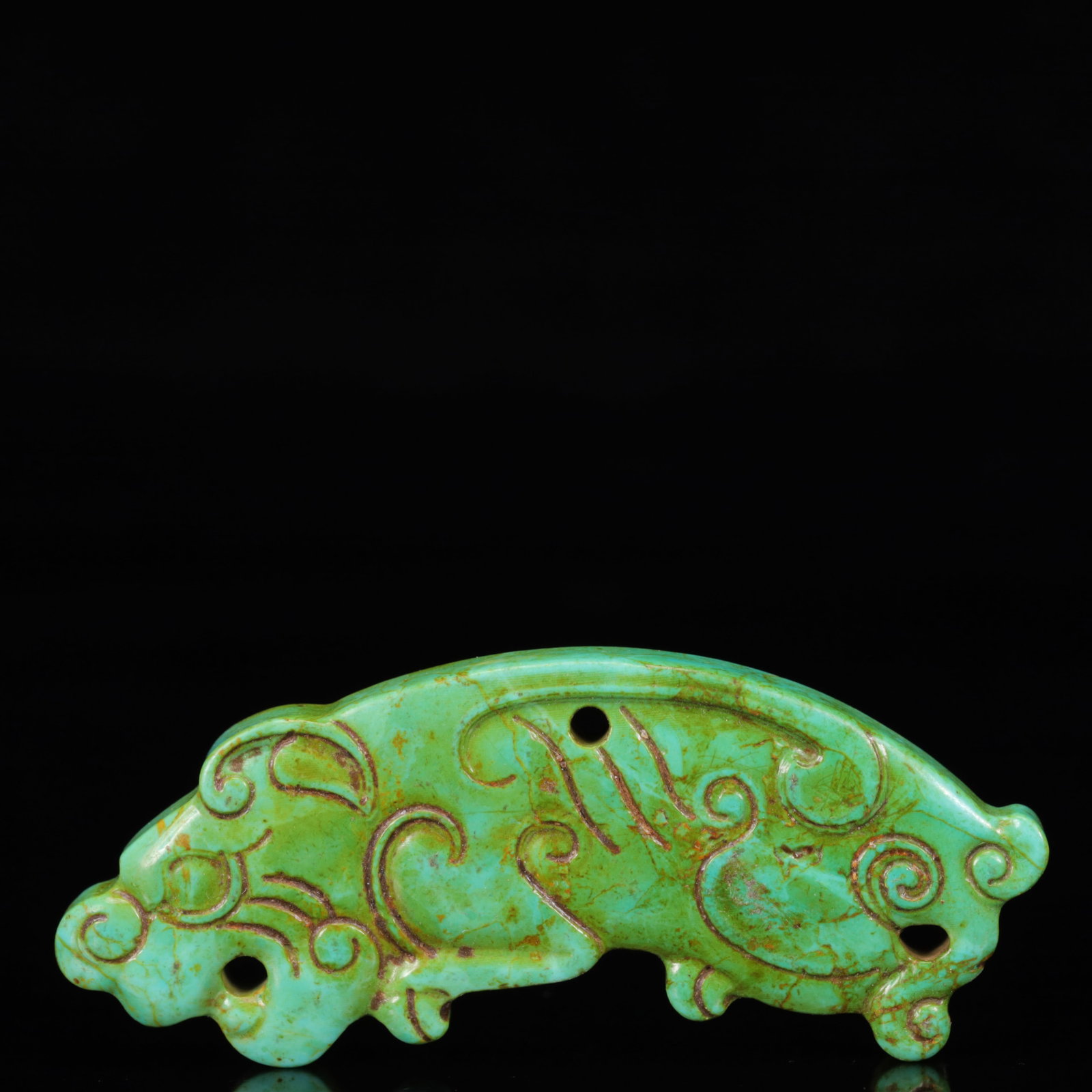 An Exquisite Turquoise Animal Pattern Pendant: An Exquisite Turquoise Animal Pattern Pendant,The Warring States period in China,Size:2.8inx1.2inx0.3in,Weight:24g 绿松石动物纹挂件,中国