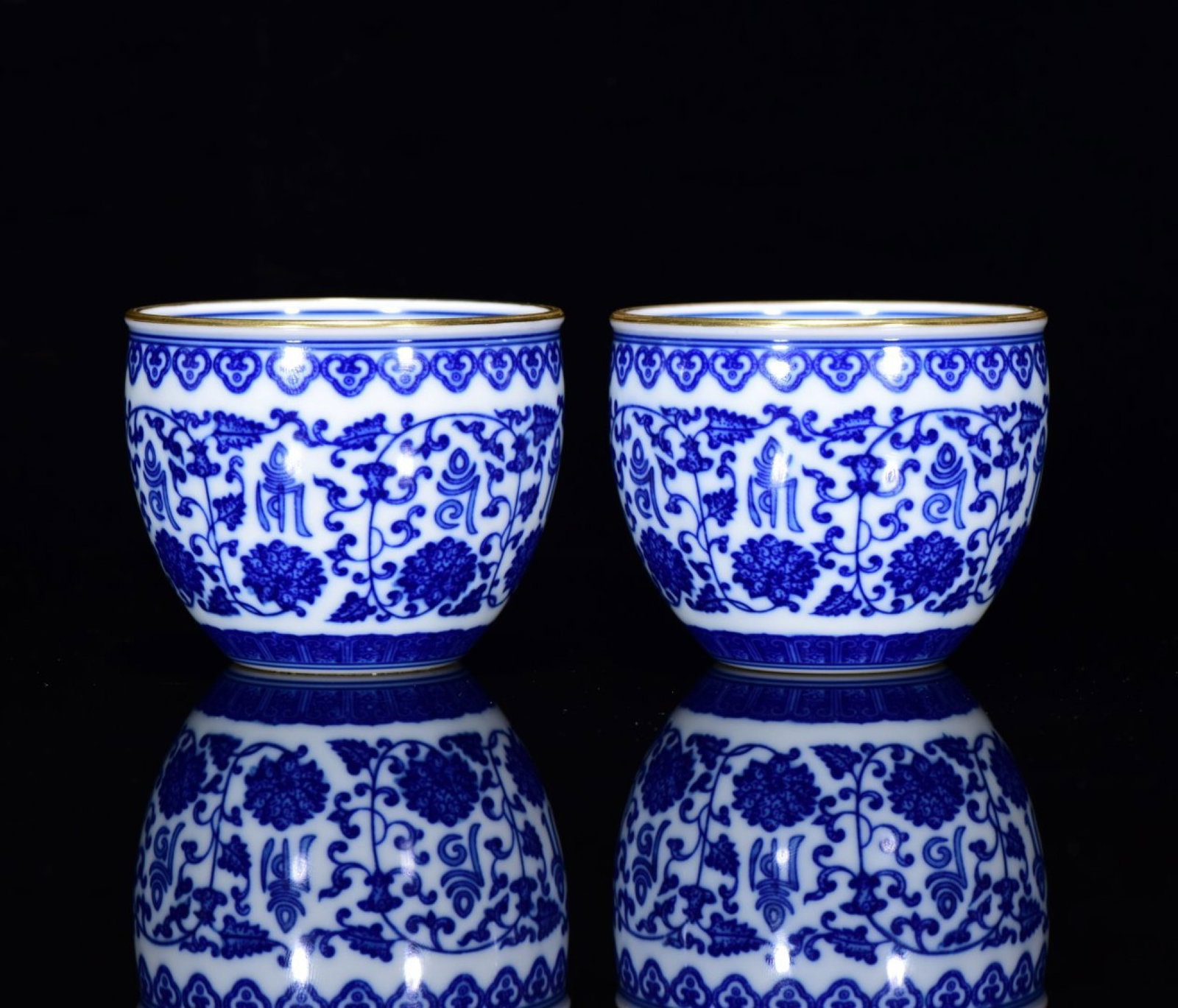 A Pair of Exquisite Blue and White Lotus Pattern Bowls,With Sanskrit: A Pair of Exquisite Blue and White Lotus Pattern Bowls,With Sanskrit,Qing Dynasty,China,Yongzheng Six-character Mark,Size:2.4inx2.8ins 一对青花缠枝莲纹&