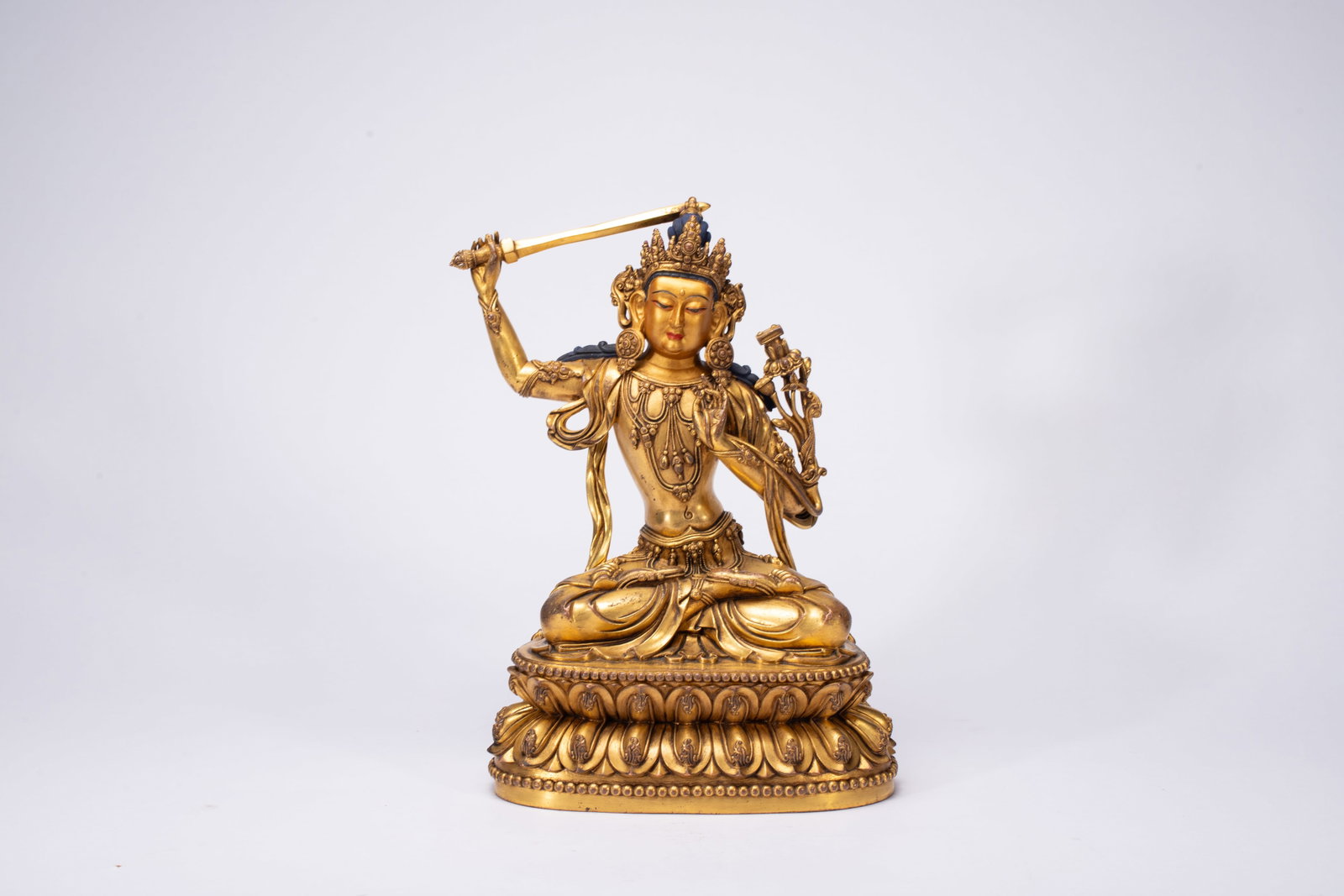 A Solemn Gilt Bronze Statue of Manjusri: A Solemn Gilt Bronze Statue of Manjusri,Ming Dynasty,China,Yongle Six-character Mark,Size:7.5inx5.1inx11in,Weight:3330g 铜鎏金文殊菩萨像,中国