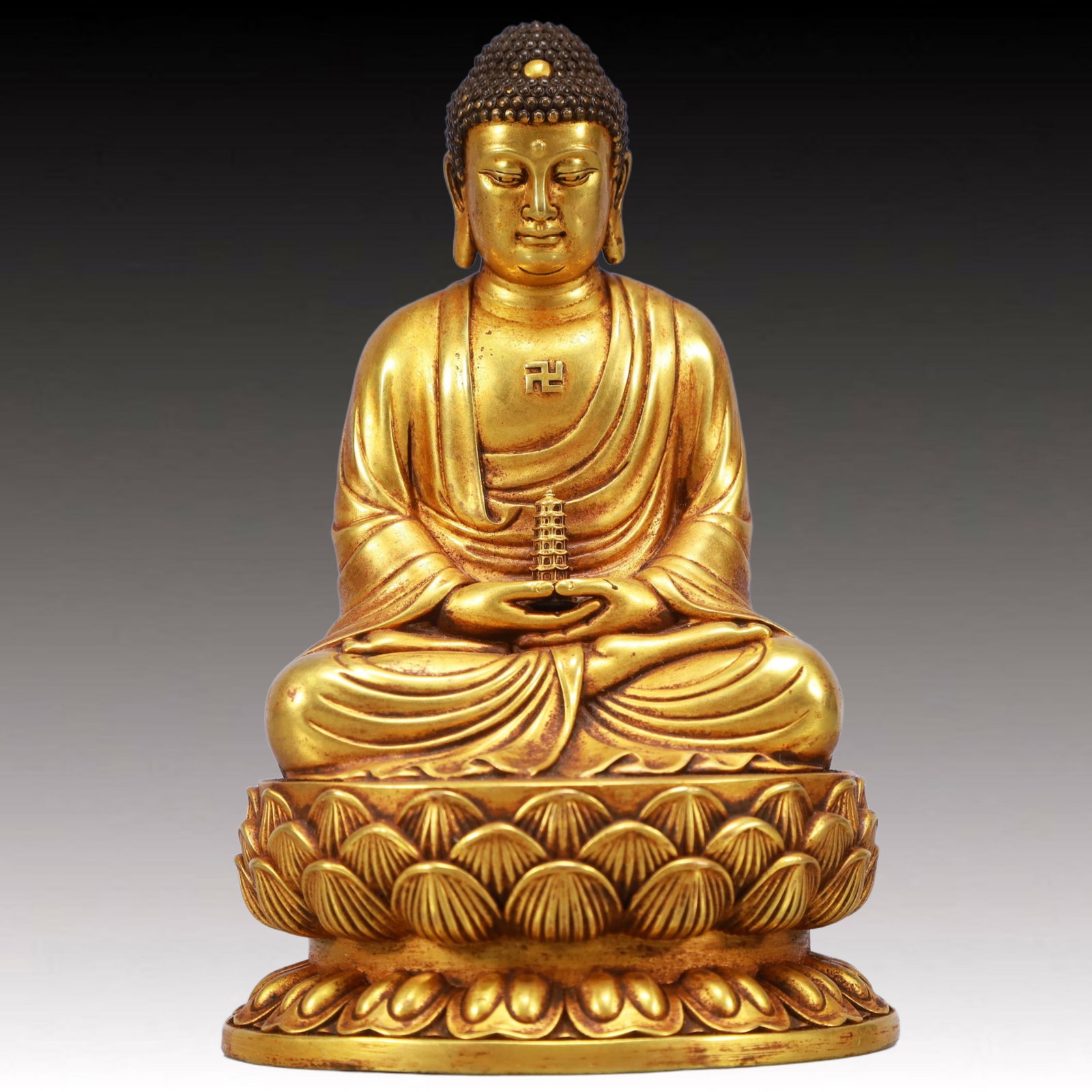 A Solemn Gilt Bronze Statue of Sakyamuni: A Solemn Gilt Bronze Statue of Sakyamuni,Ming Dynasty, China,Yongle Six-character Mark,Size:4.1inx3.3inx6.3in,Weight:2050g 铜鎏金如来像,中国明