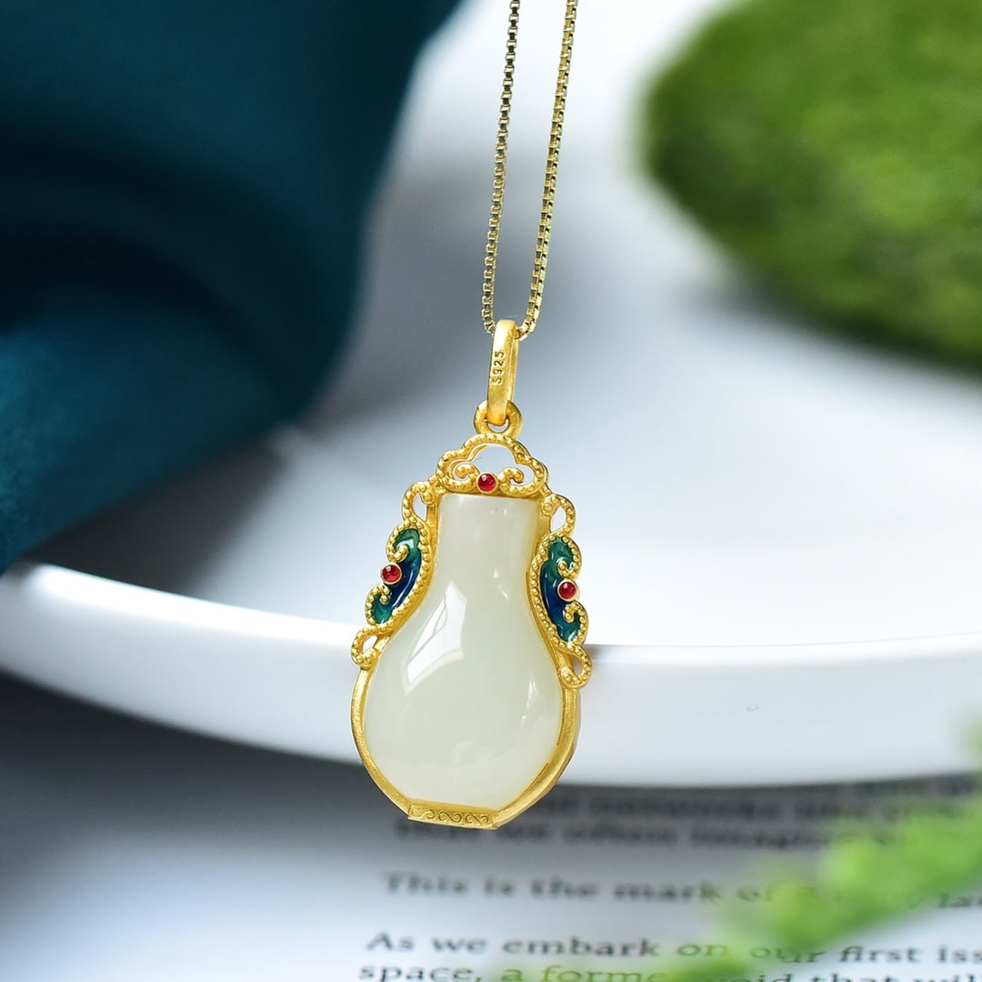An Exquisite Sterling Silver-Gold Plated Inlaid White Jade Pendant: An Exquisite Sterling Silver-Gold Plated Inlaid White Jade Pendant 纯银镀金镶白玉吊坠