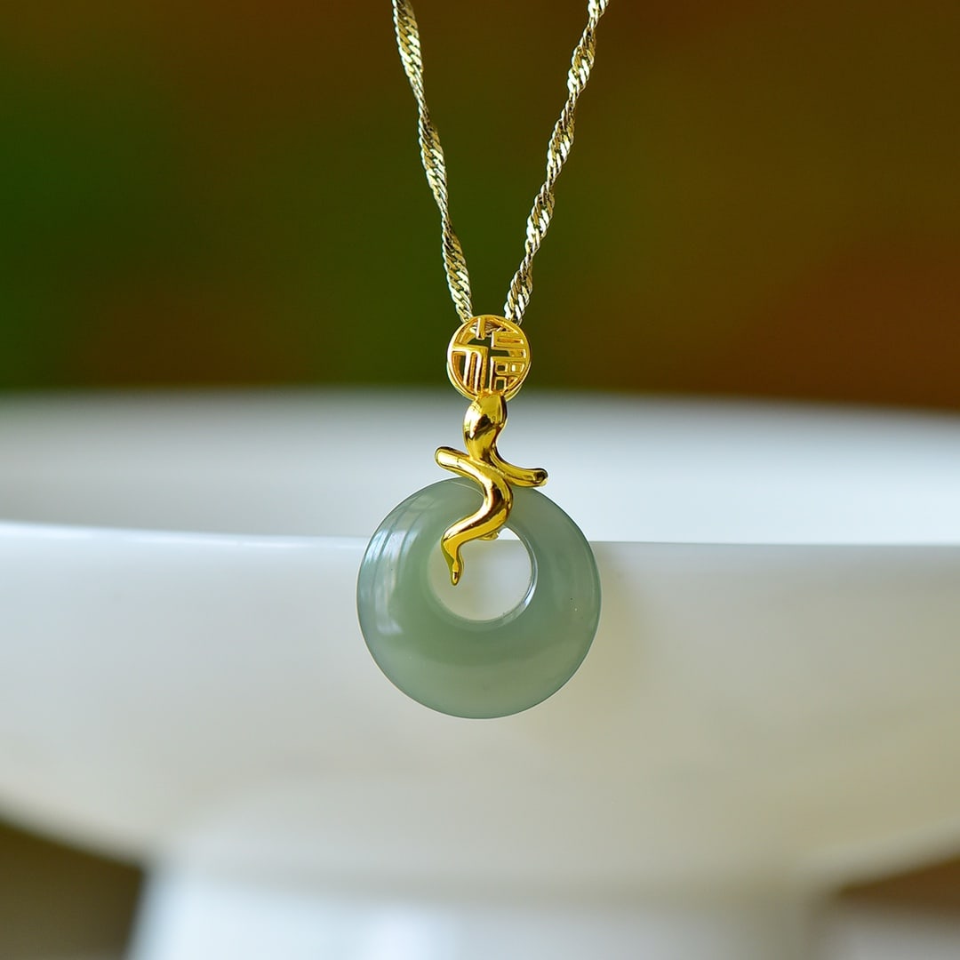 An Exquisite Sterling Silver-Gold Plated Inlaid Greenish Jade Pendant: An Exquisite Sterling Silver-Gold Plated Inlaid Greenish Jade Pendant,Size:15mmx15mm 纯银镀金镶青玉吊坠