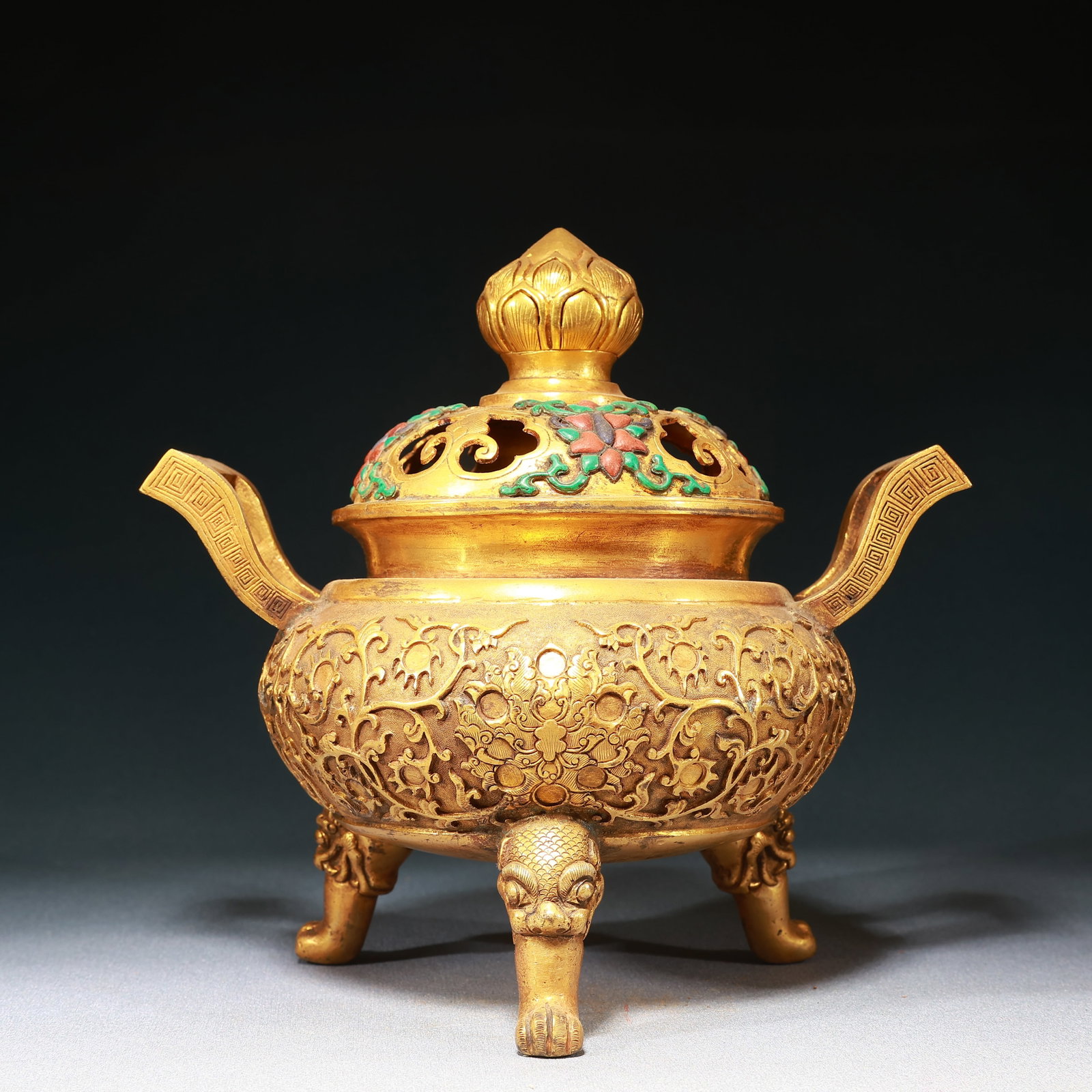 An Exquisite Gilt Bronze Lotus Pattern Double-Ears Tripod Censer: An Exquisite Gilt Bronze Lotus Pattern Double-Ears Tripod Censer,Qing Dynasty,China,Size:8.9inx6.3inx8.9in,Weight:1700g 铜鎏金缠枝莲纹双耳三
