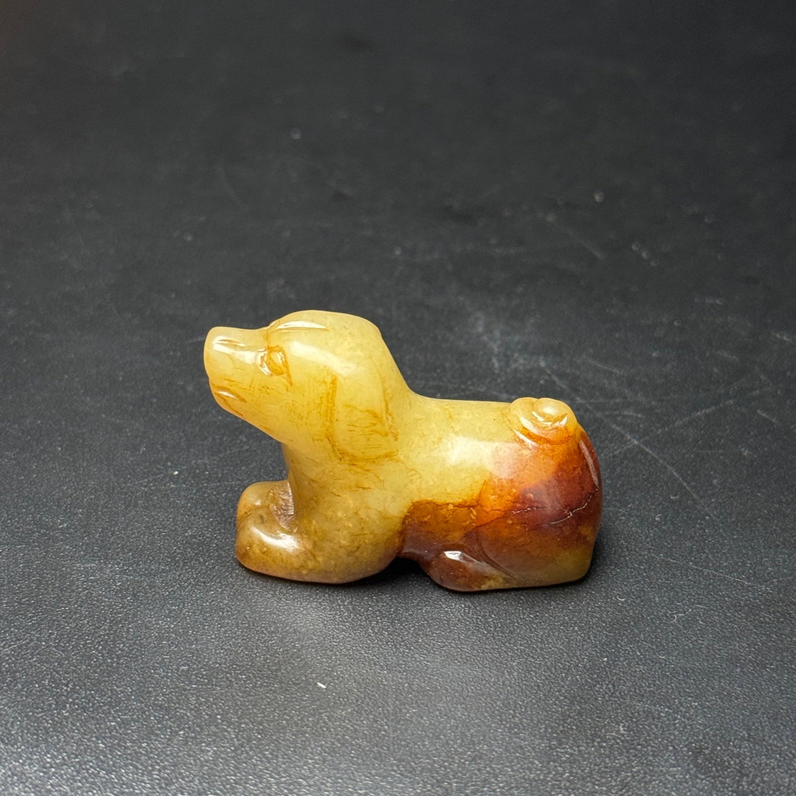 An Exquisite White Jade Dog Ornament: An Exquisite White Jade Dog Ornament,Qing Dynasty,China,Size:41mmx27mmx19mm,Weight:29g 白玉犬摆件,中国清代
