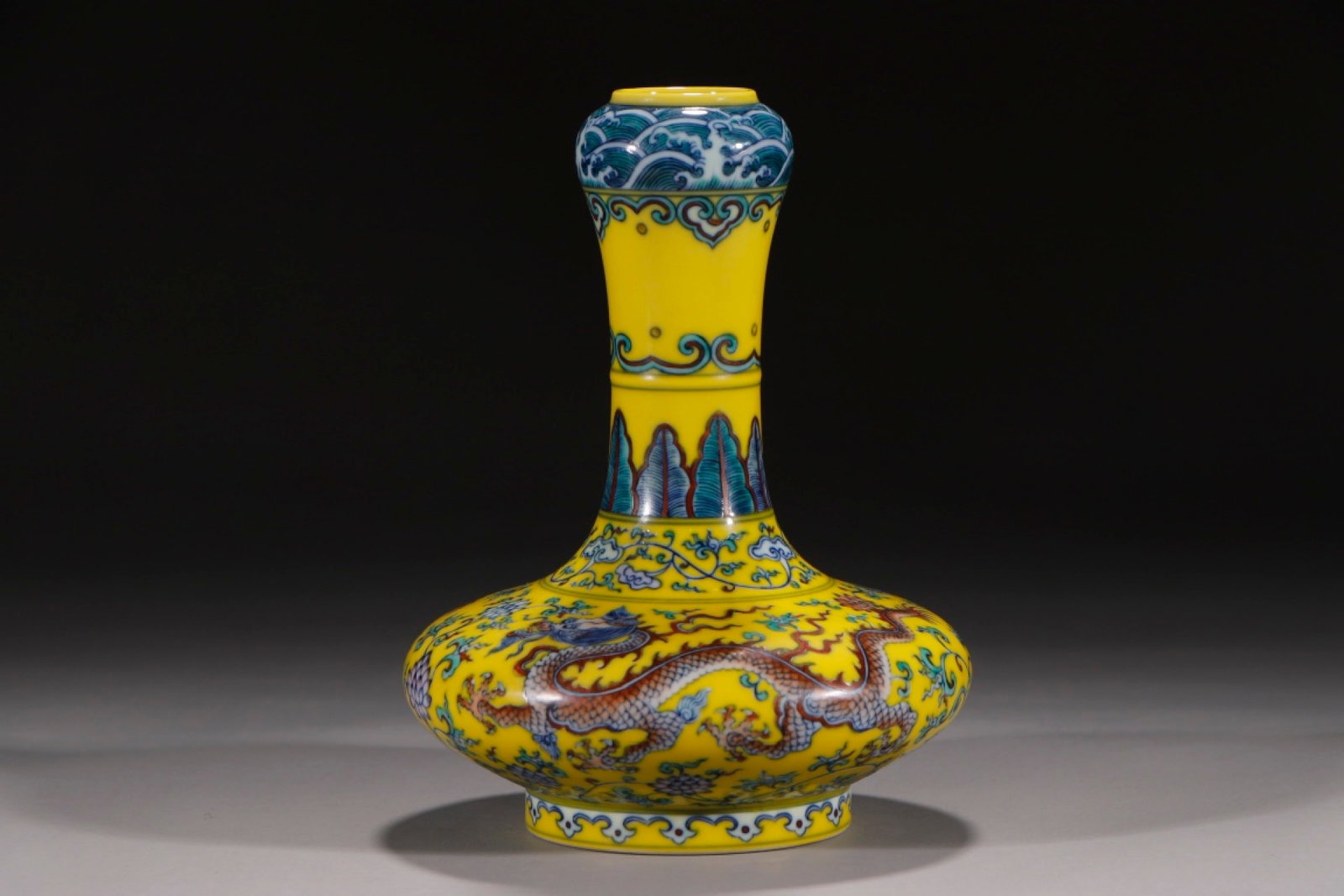 An Exquisite Yellow Ground Doucai Lotus and Dragon Pattern Vase: An Exquisite Yellow Ground Doucai Lotus and Dragon Pattern Vase,Qing Dynasty,China,Yongzheng Six-character Mark,Size:8.1in 黄地斗彩缠枝莲龙纹ī