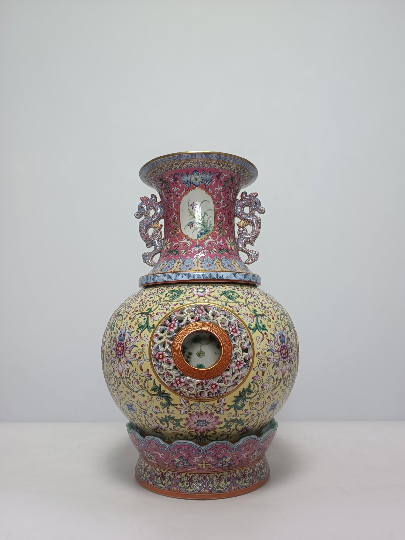 An Exquisite Famille-Rose Yellow Ground Lotus Pattern Double-Ears Vase: An Exquisite Famille-Rose Yellow Ground Lotus Pattern Double-Ears Vase,Qing Dynasty,China,Qianlong Six-character Mark,Size:16.1inx10.4in 粉彩黄地缠枝莲纹