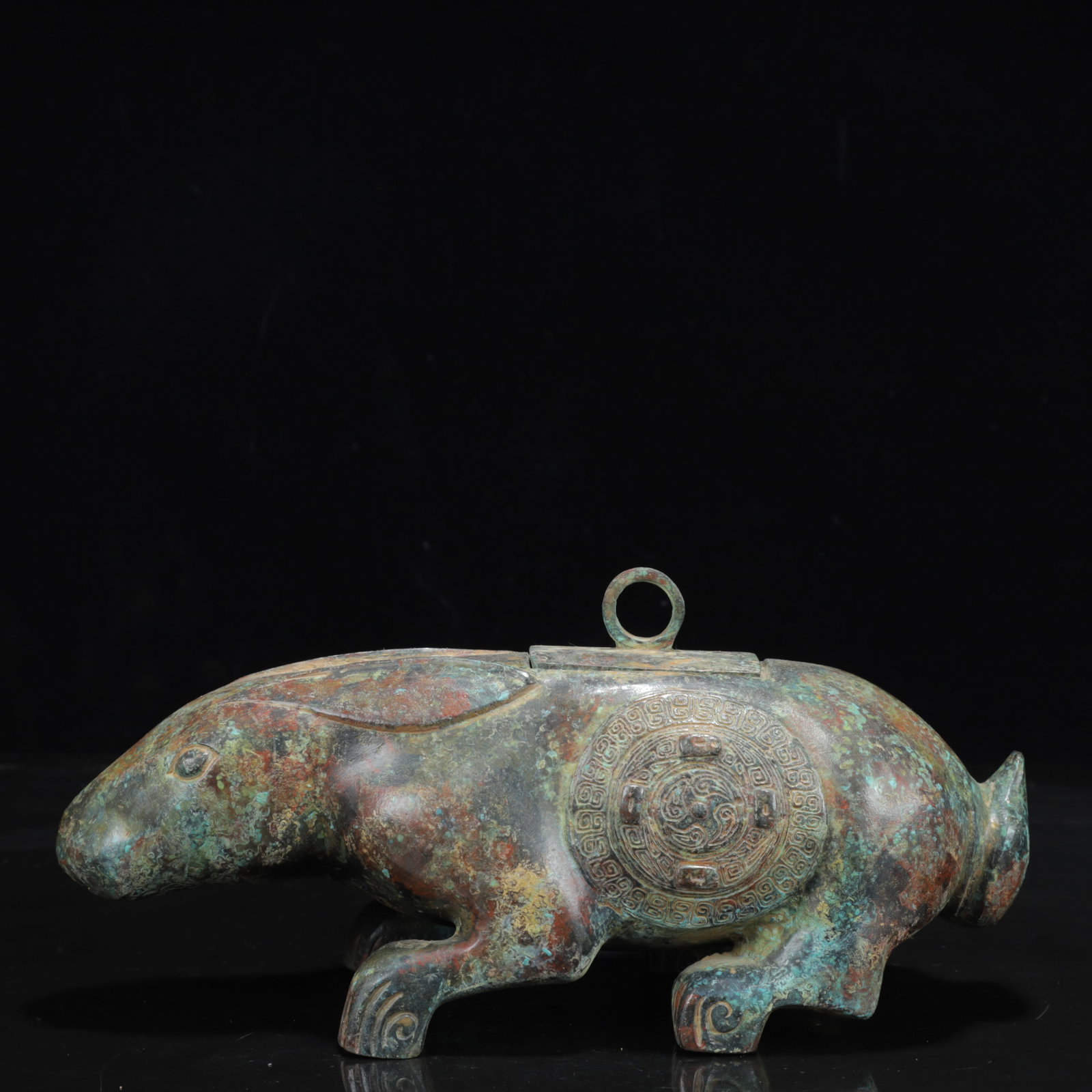 An Archaic Bronze Auspicious Beast Ornament: An Archaic Bronze Auspicious Beast Ornament,the Warring States Period in China,Size:9.8inx3.9inx3.5in,Weight:1700g 青铜瑞兽摆件,中国战国