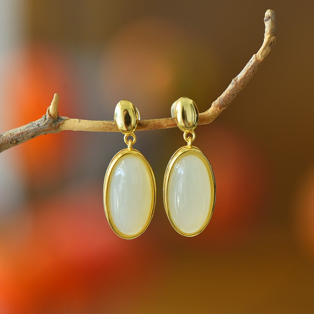 A Pair of Exquisite Sterling Silver-Gold Plated Inlaid White Jade Earrings: A Pair of Exquisite Sterling Silver-Gold Plated Inlaid White Jade Earrings,Size:9mmx17mm 一对纯银镀金镶白玉耳环