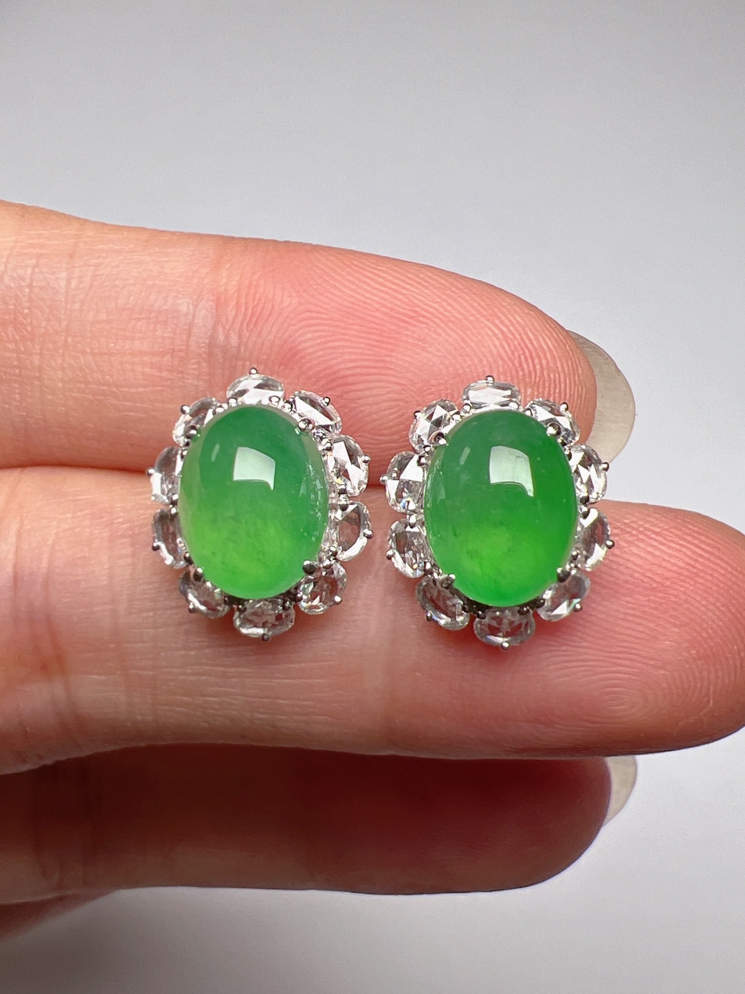 A Pair of Exquisite 18k Gold Diamond Inlaid Jadeite Earrings: A Pair of Exquisite 18k Gold Diamond Inlaid Jadeite Earrings,Size(Loose Stone):9.2mmx7.2mmx5.6mm 一对18k金钻镶嵌翡翠耳钉