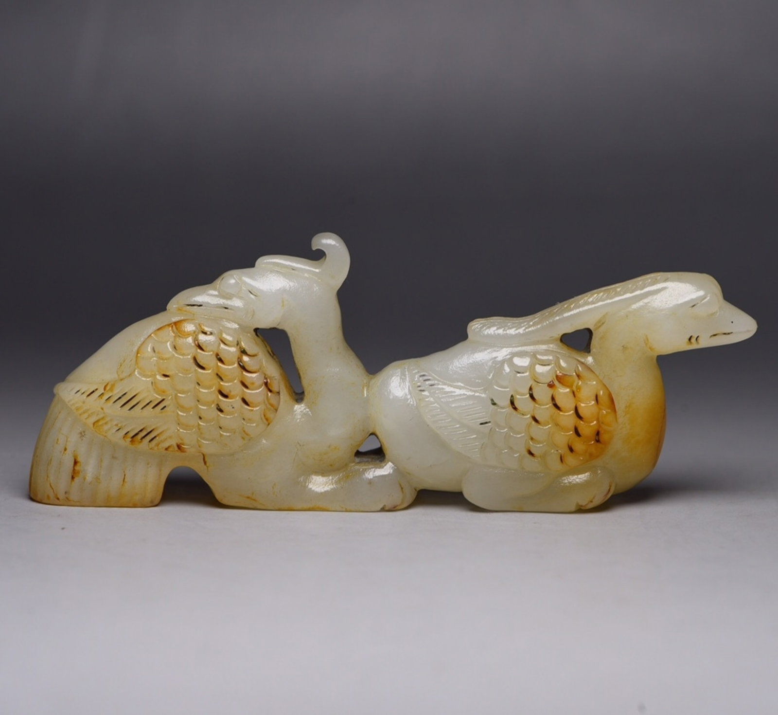 An Exquisite White Jade Phoenix Ornament: An Exquisite White Jade Phoenix Ornament,Qing Dynasty,China,Size:4.5inx1.7inx0.7in,Weight:109g 白玉凤摆件,中国清代