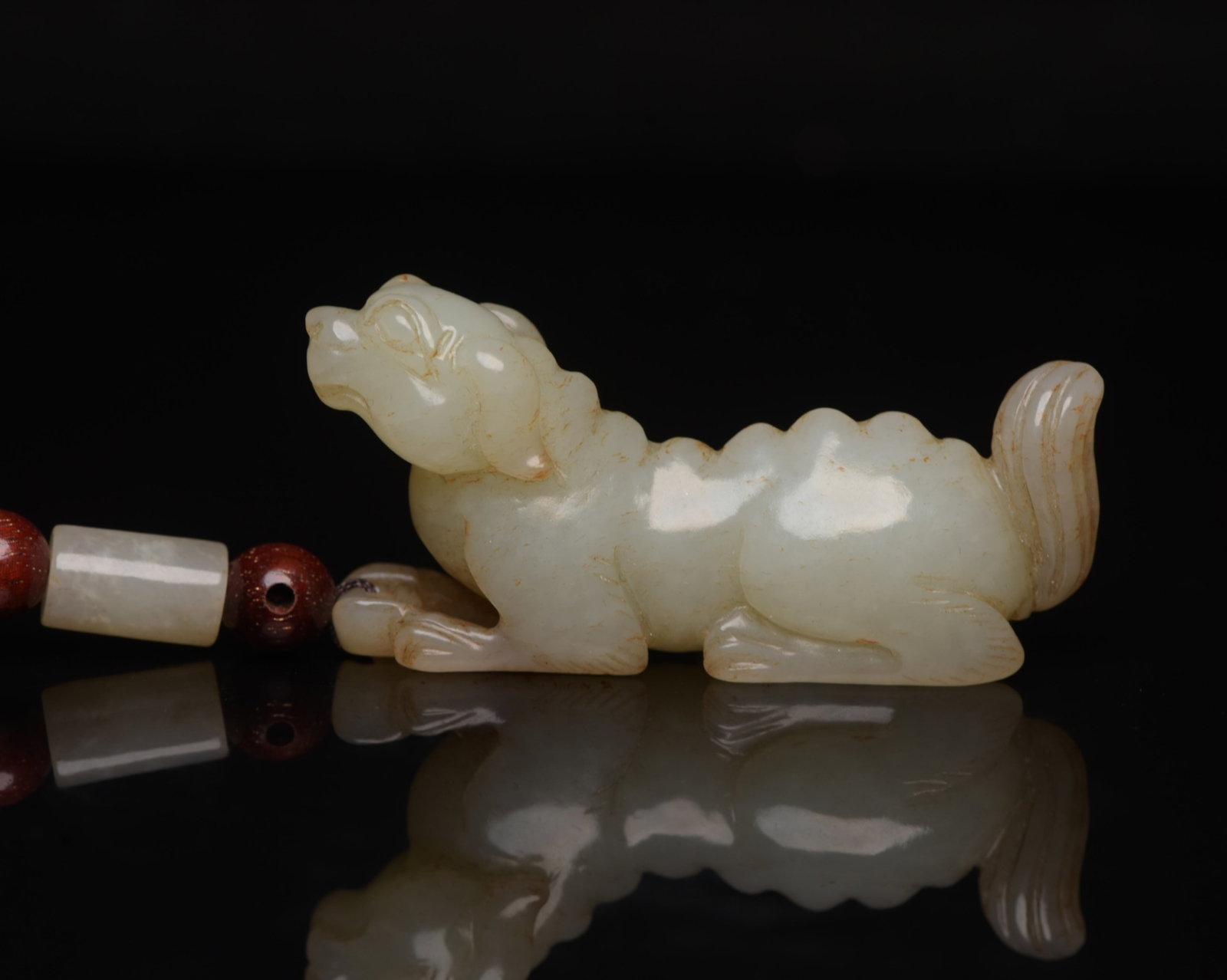 An Exquisite White Jade Dog Ornament: An Exquisite White Jade Dog Ornament,Qing Dynasty,China,Size:2.3inx1.1inx0.6in,Weight:36g 白玉犬摆件,中国清代