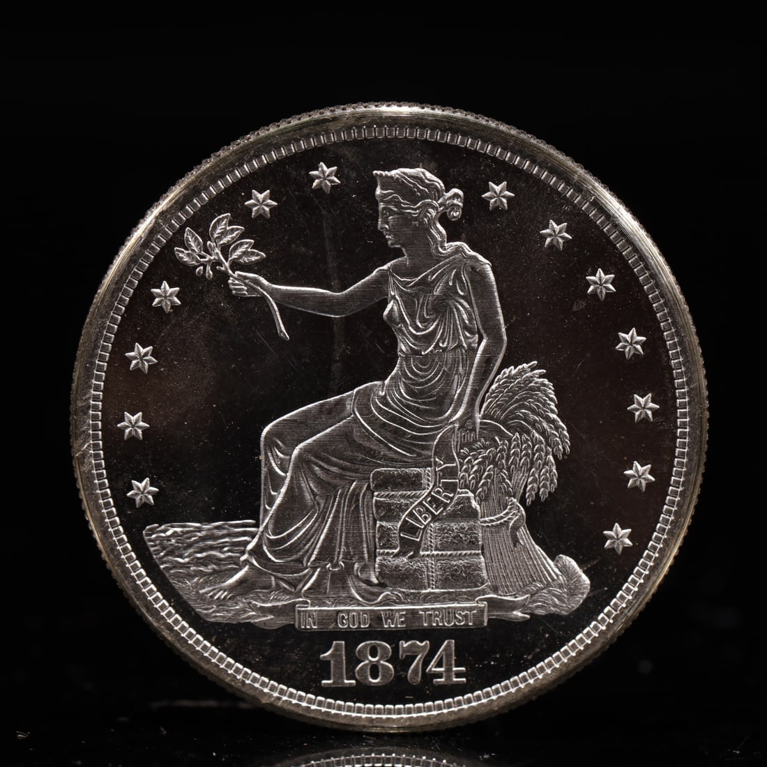 USA Trade Dollar 1874 Coin: American coin. Obverse: Liberty seated on a pedestal facing the sea to the left holding olive branches surrounded by 13 stars. IN GOD WE TRUST / LIBERTY / 1874. Reverse: An eagle holding branches